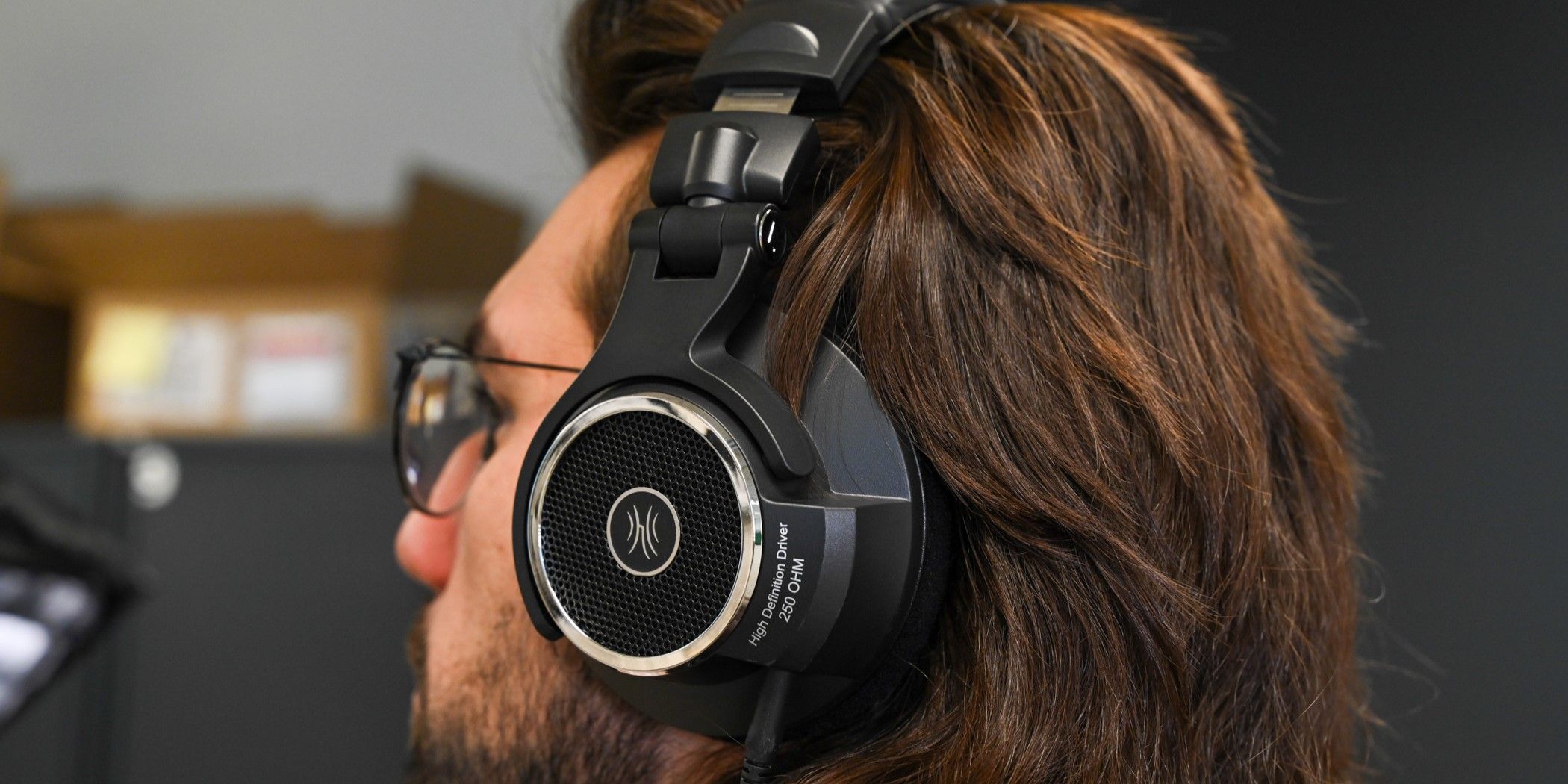 Person wearing a pair of OneOdio Monitor 80 Open Back Headphones