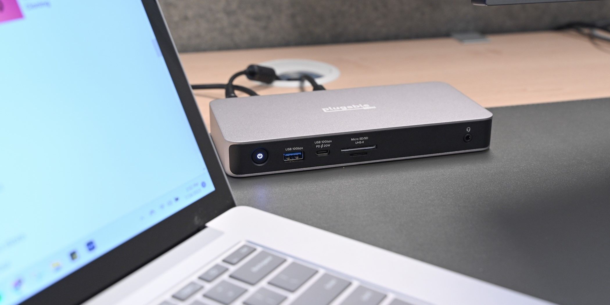 Plugable docking station connected to a laptop and monitor