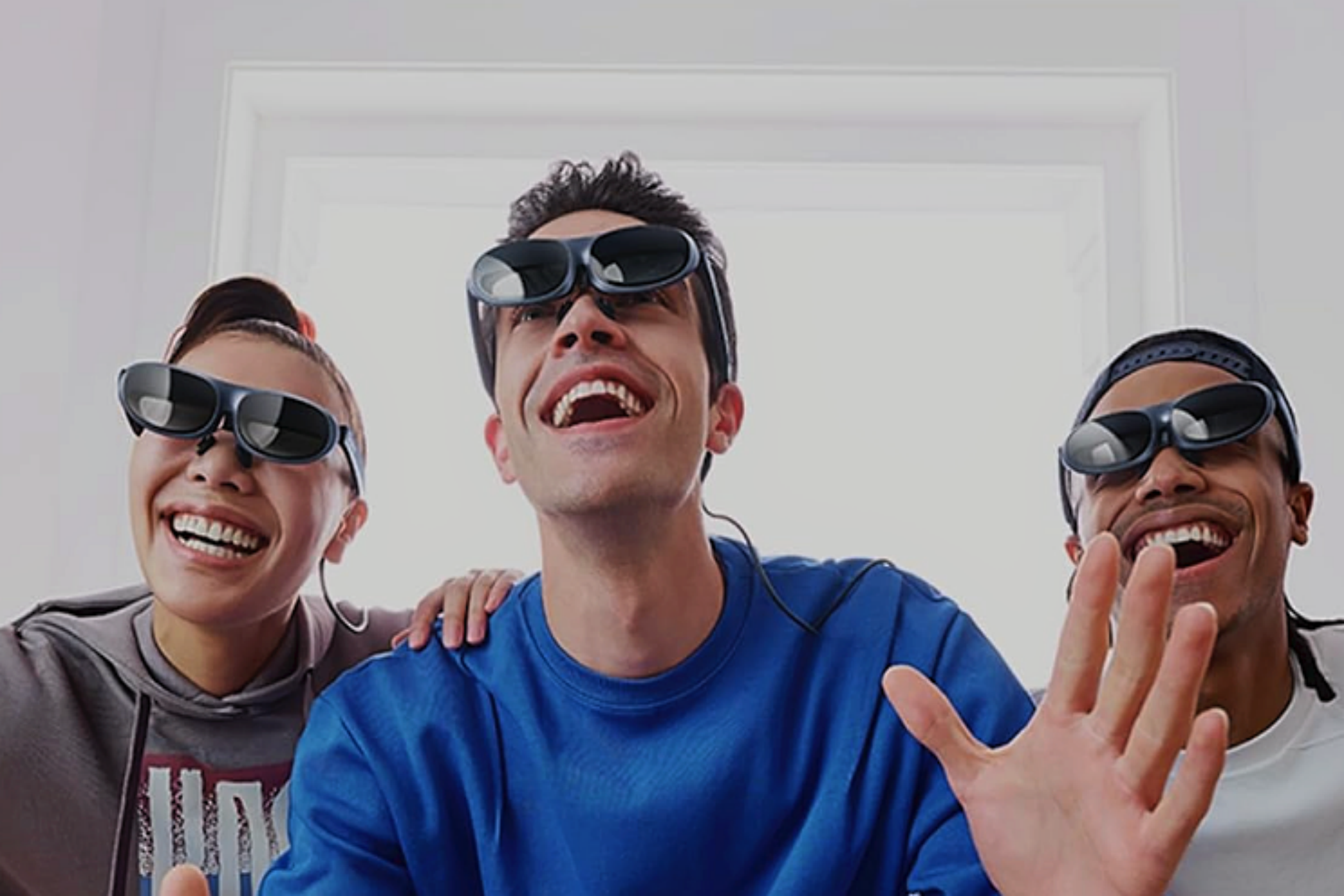 A group of friends being entertained while wearing Rokid Max smart glasses.