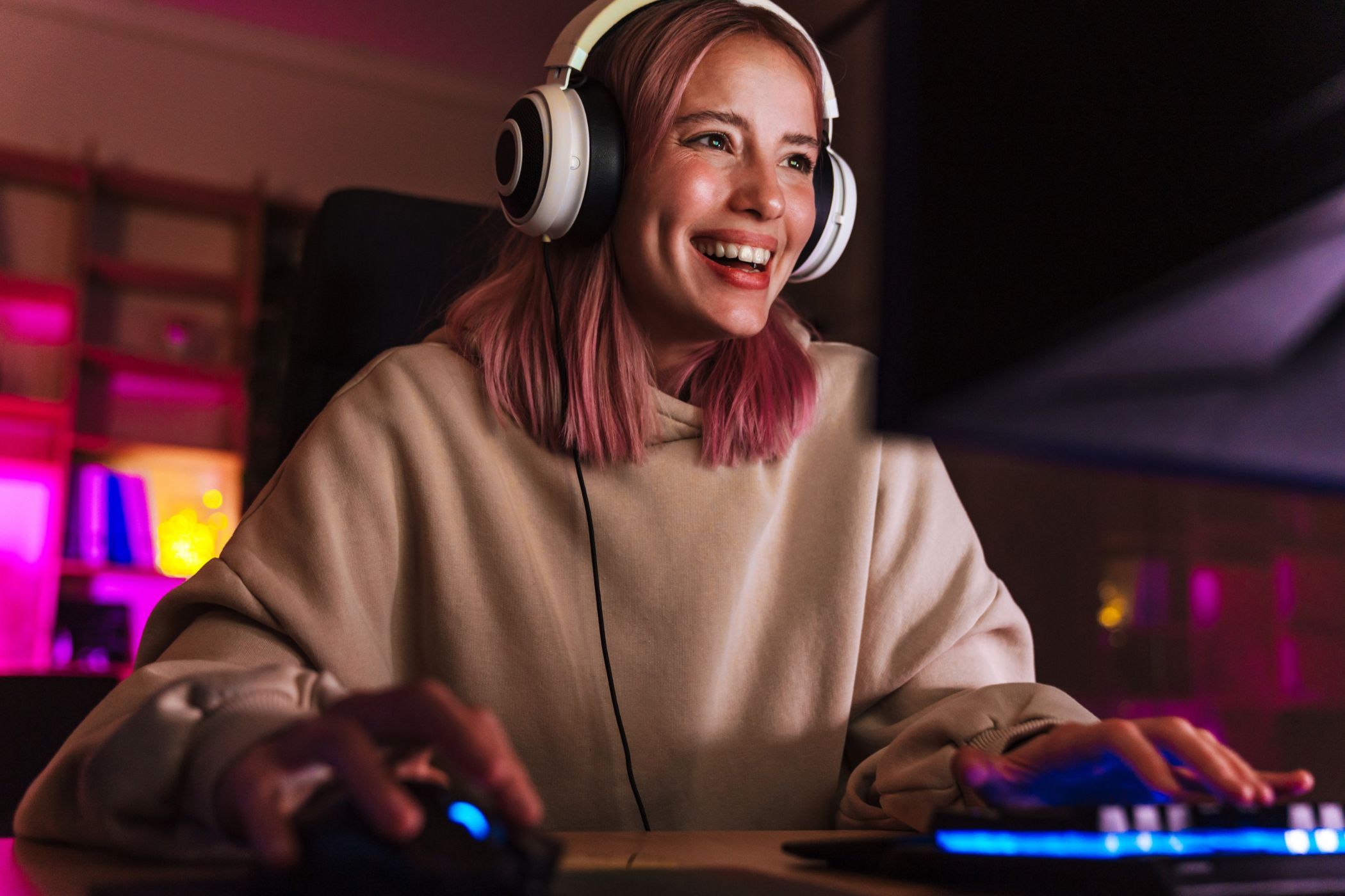 a woman in front of a gaming pc
