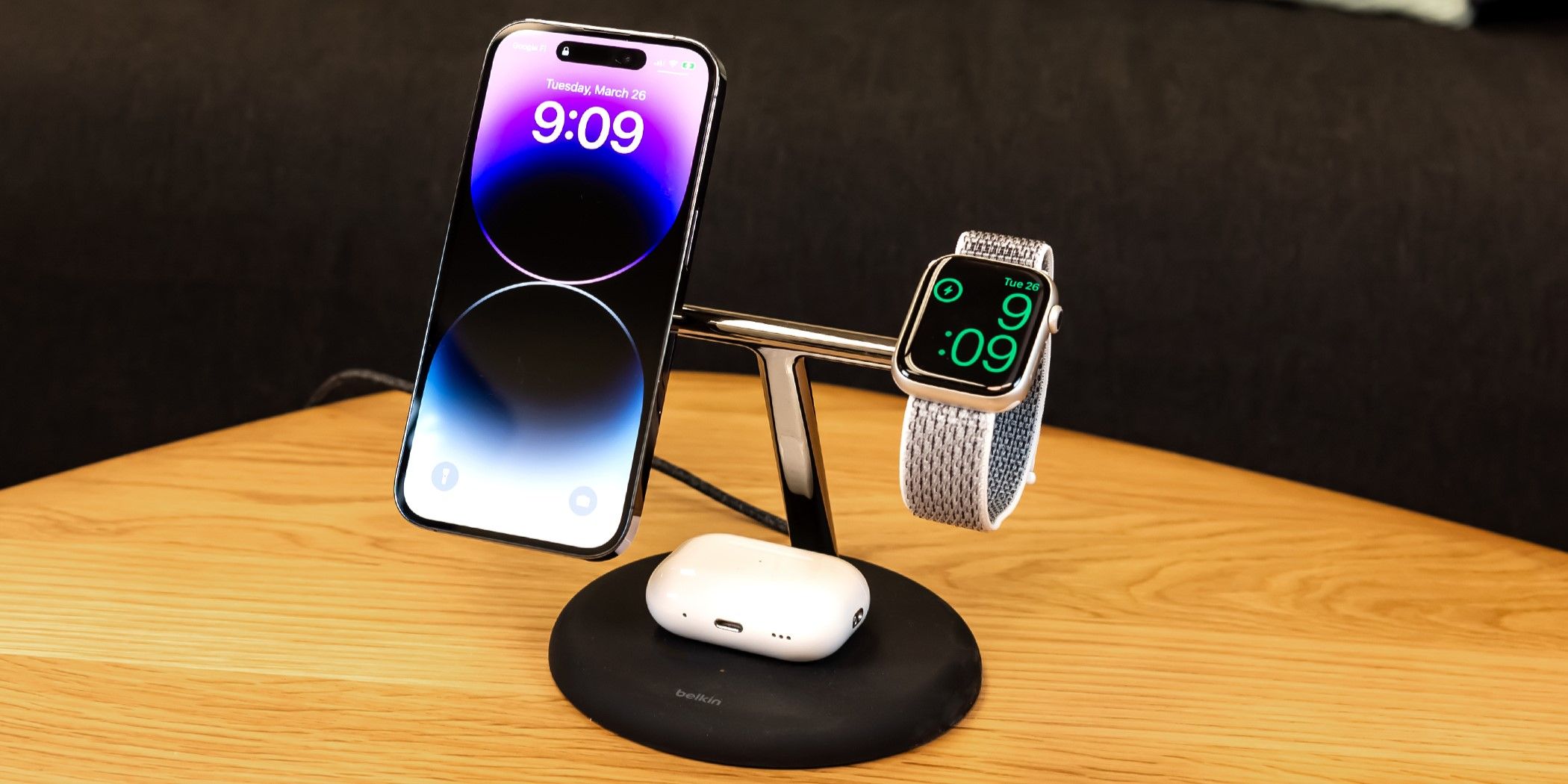 The Belkin BoostCharge Pro 3-in-1 Stand With Qi2 charging an iPhone, AirPods, and an Apple Watch