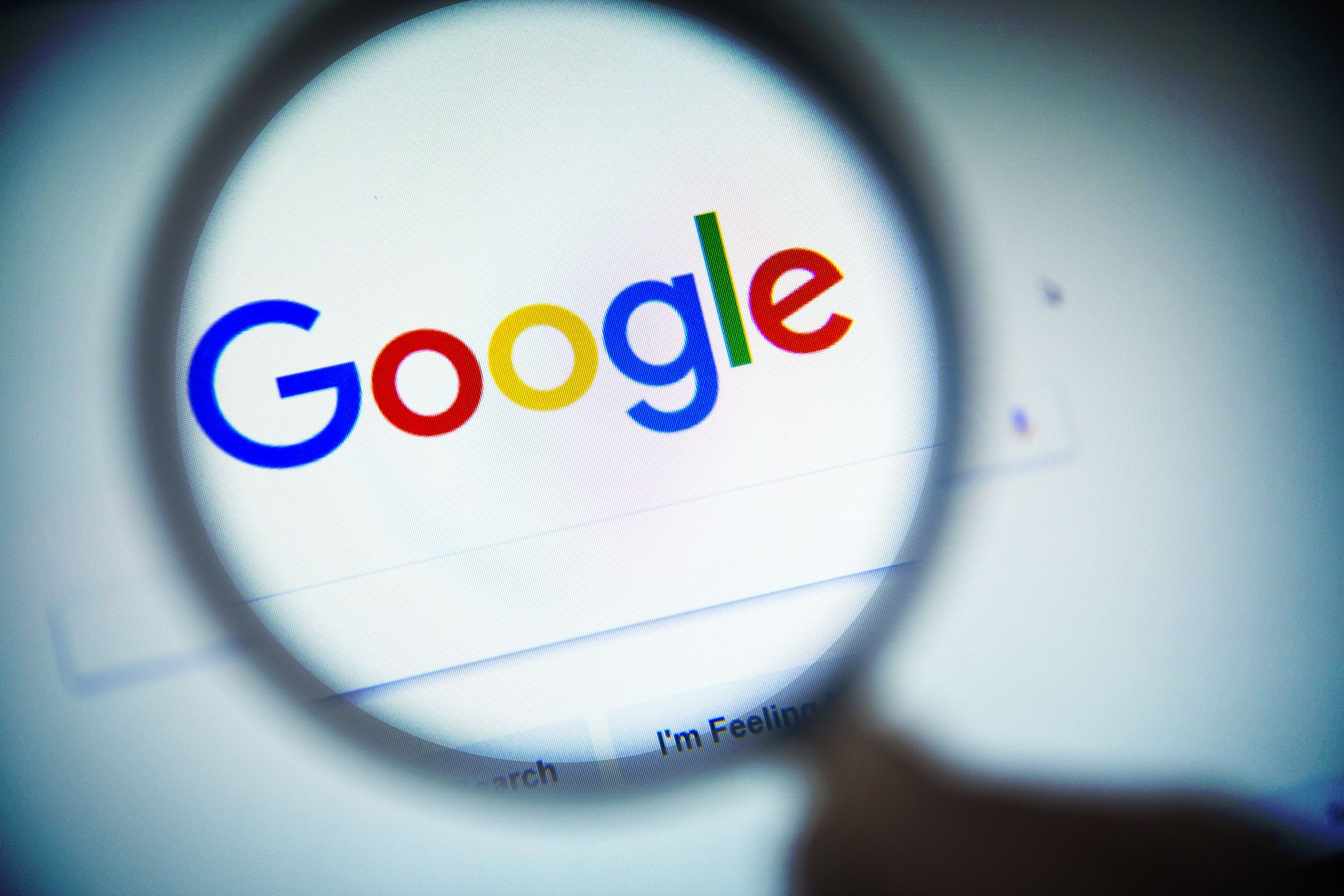 The Google search window being seen through a magnifying glass