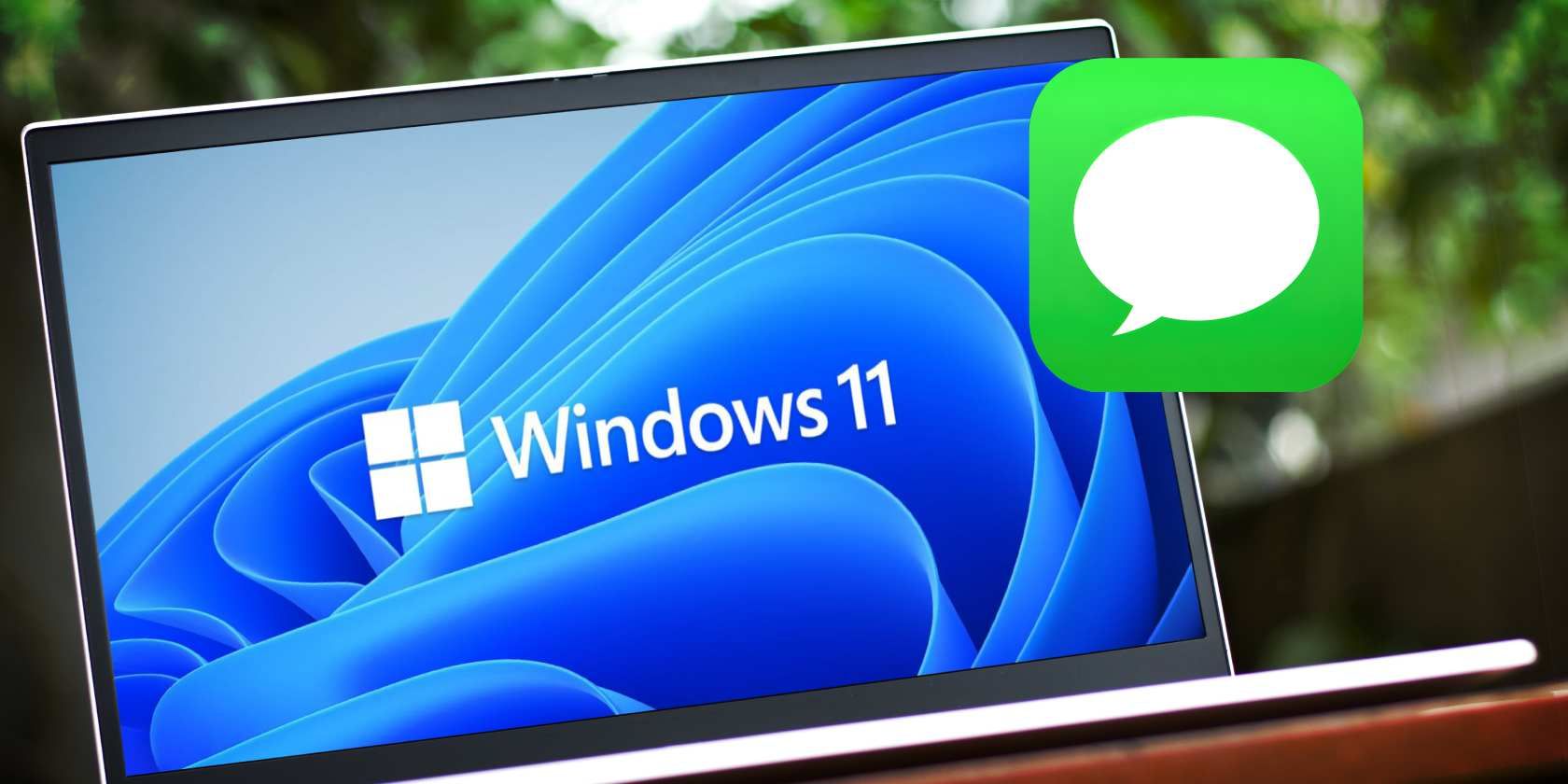 A laptop with Windows 11 wallpaper and an Imessage icon