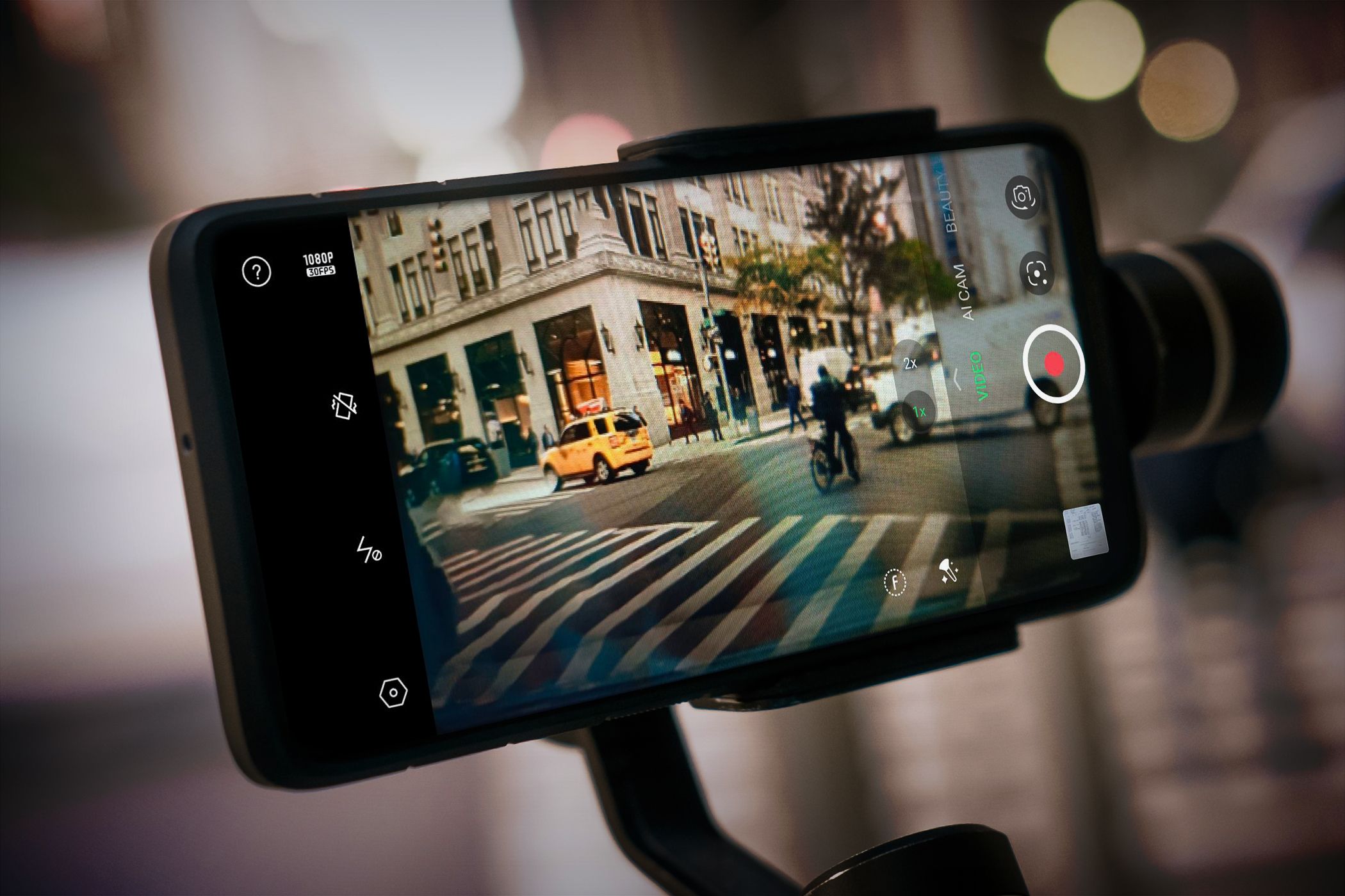 A phone recording a street while in a monopod