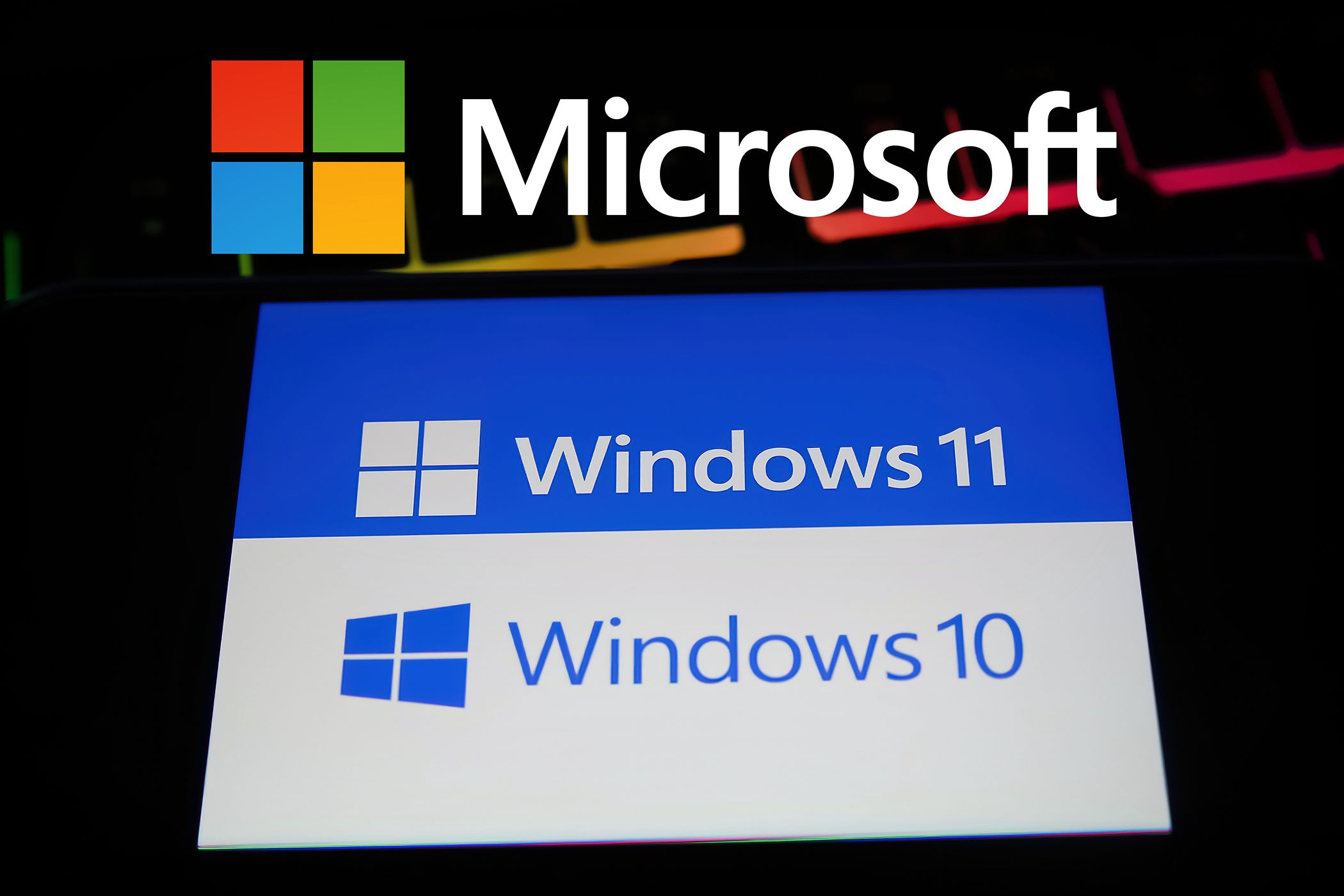 Microsoft logo over a screen with the Windows 11 and Windows 10 logos highlighting different versions of the operating system.