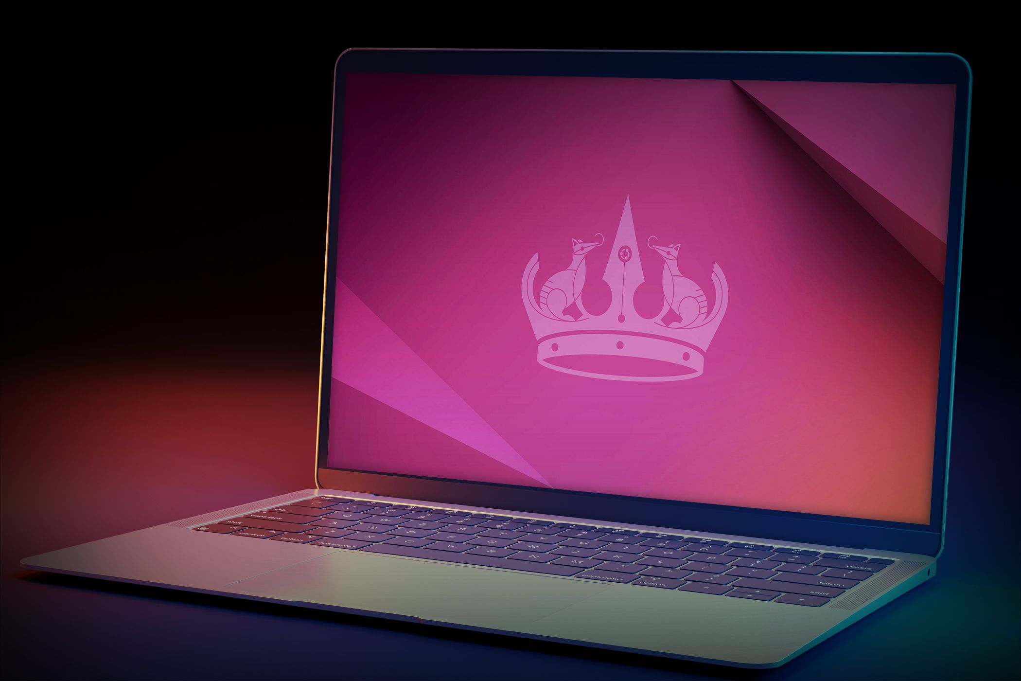 A sleek laptop with a vibrant, gradient screen showing a minimalist crown logo