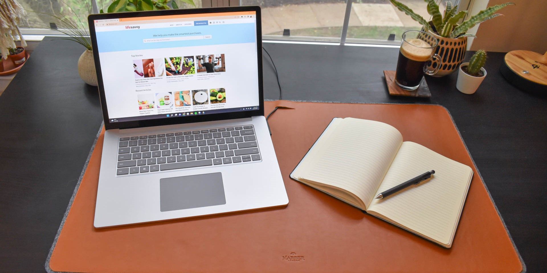 Laptop and notebook on the Harber London Leather Desk Mat