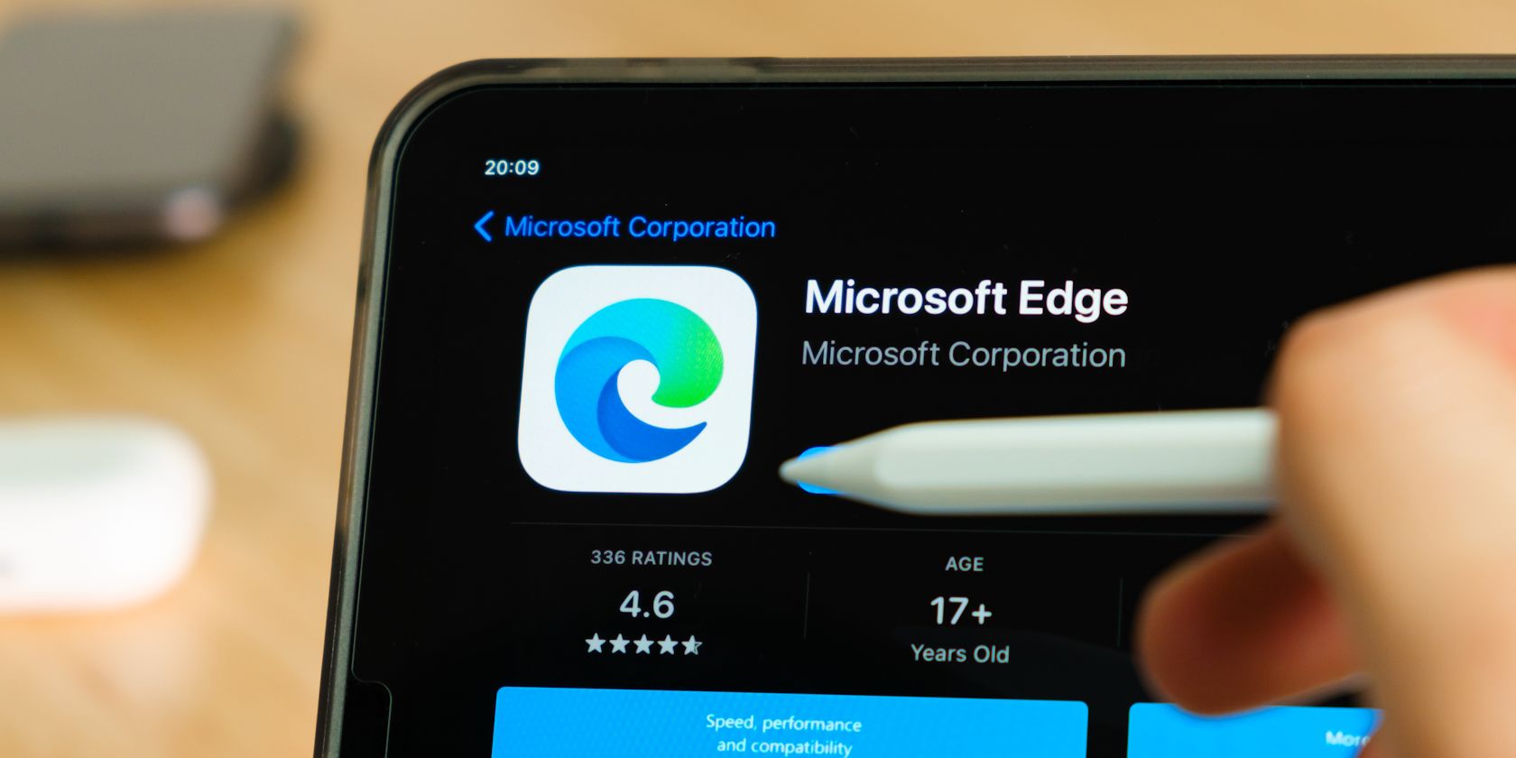 person pressing microsoft edge logo on smartphone screen