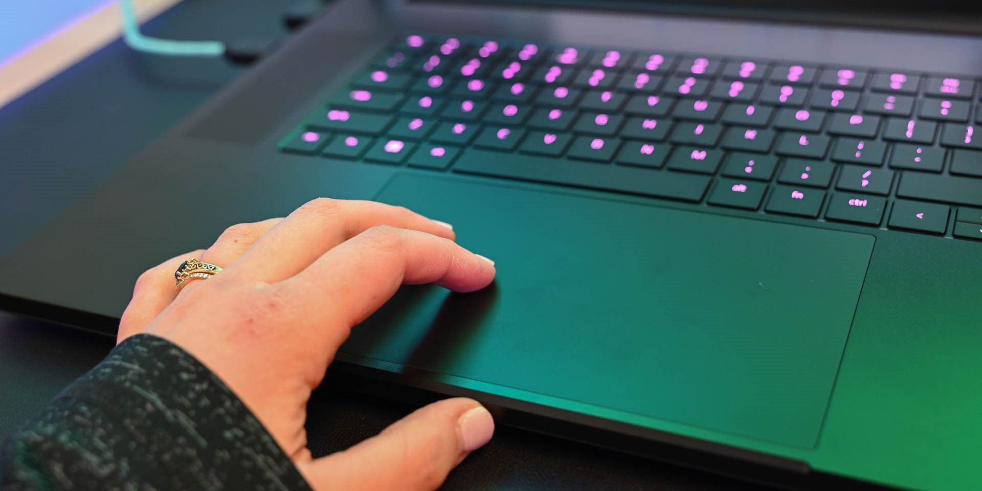 Person using a trackpad on a laptop