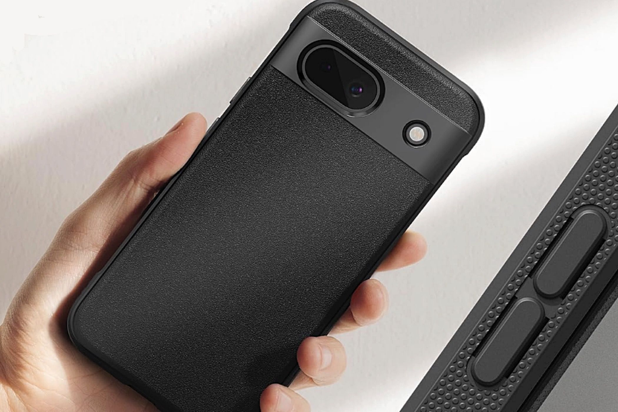 A person holding a phone in a Ringke Onyx protective case.