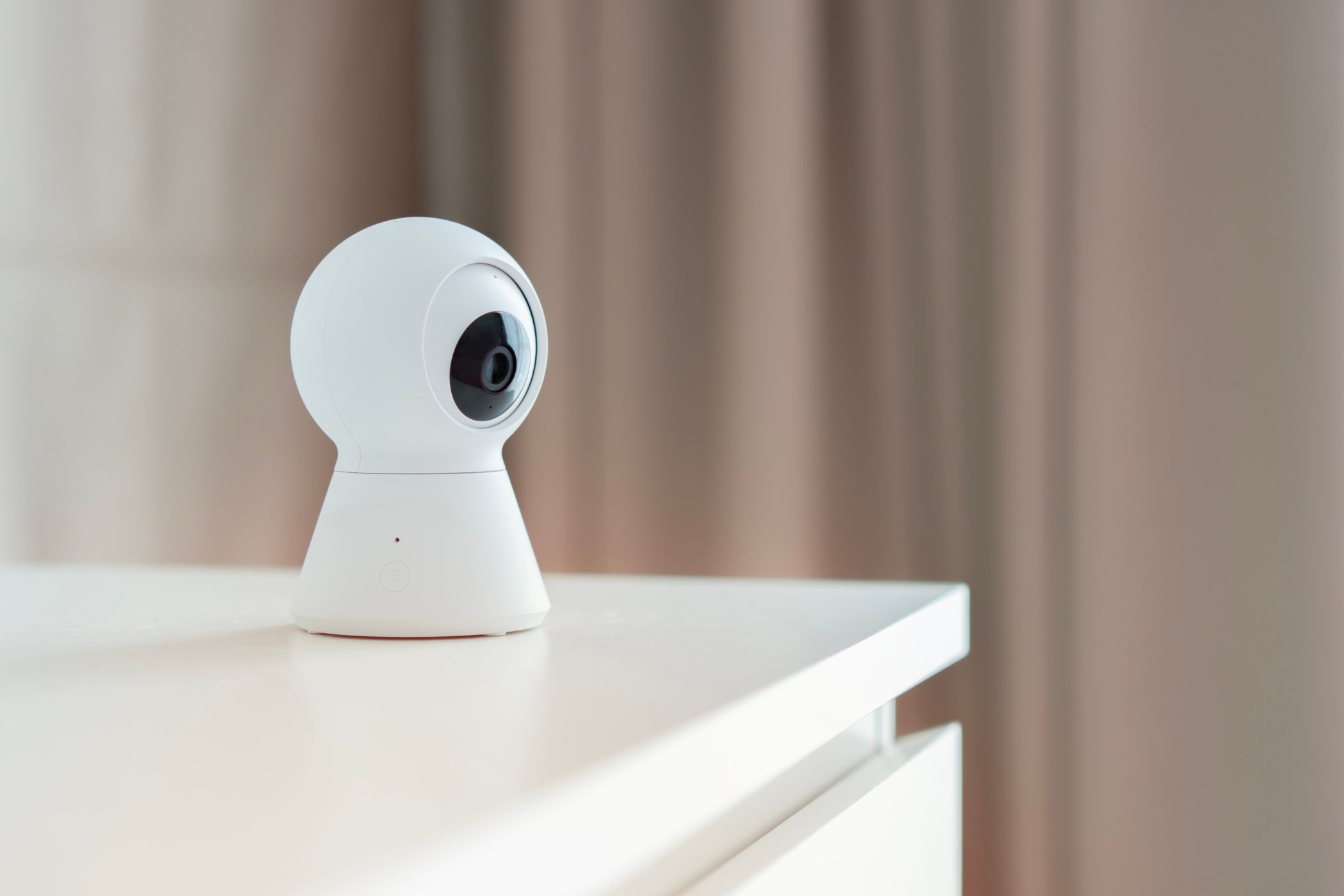 smart home security camera on a table