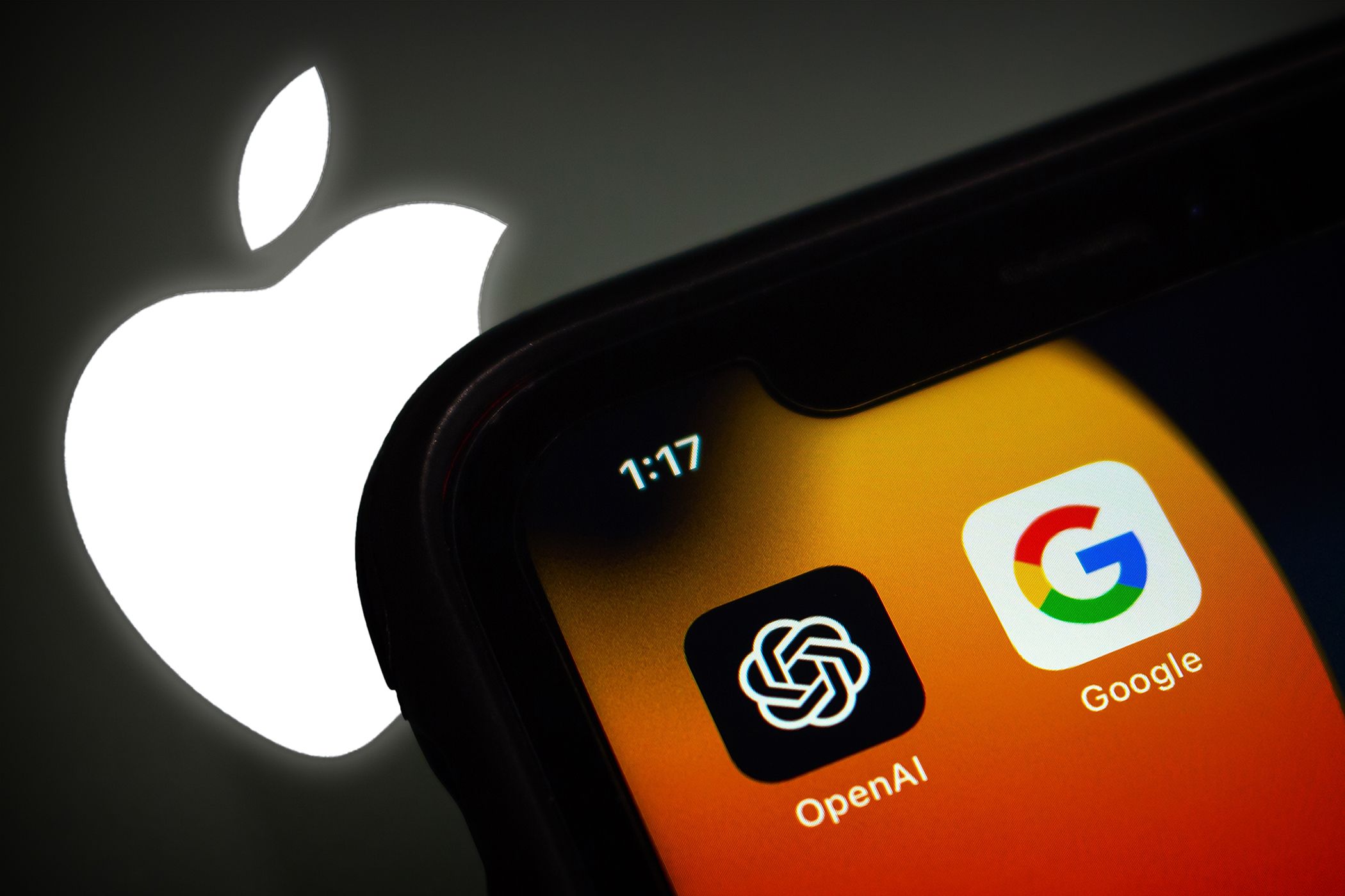 A close-up photo of an iPhone device revealing OpenAI and Google app icons