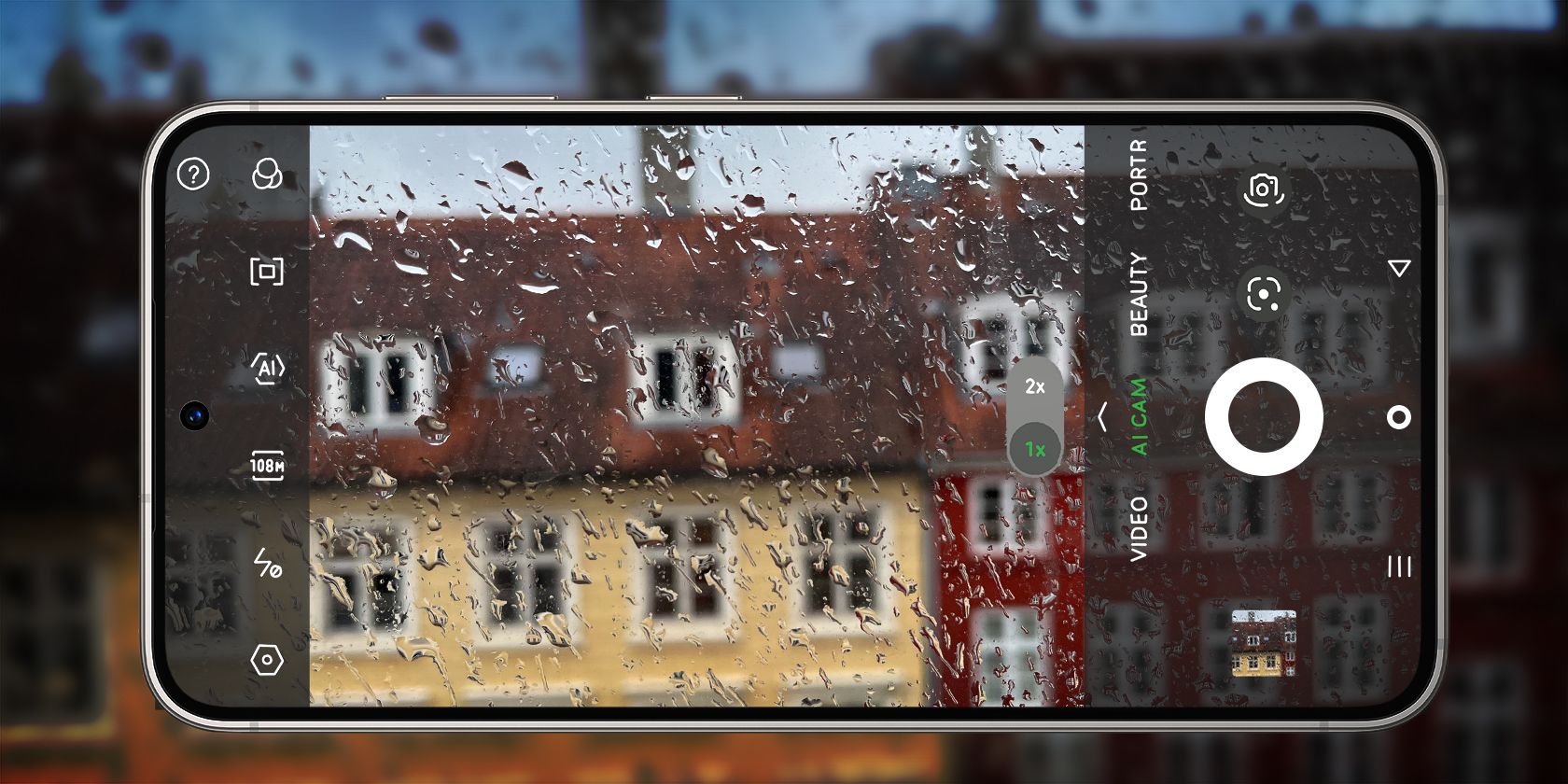 A phone with droplets of water capturing a rainy scenery