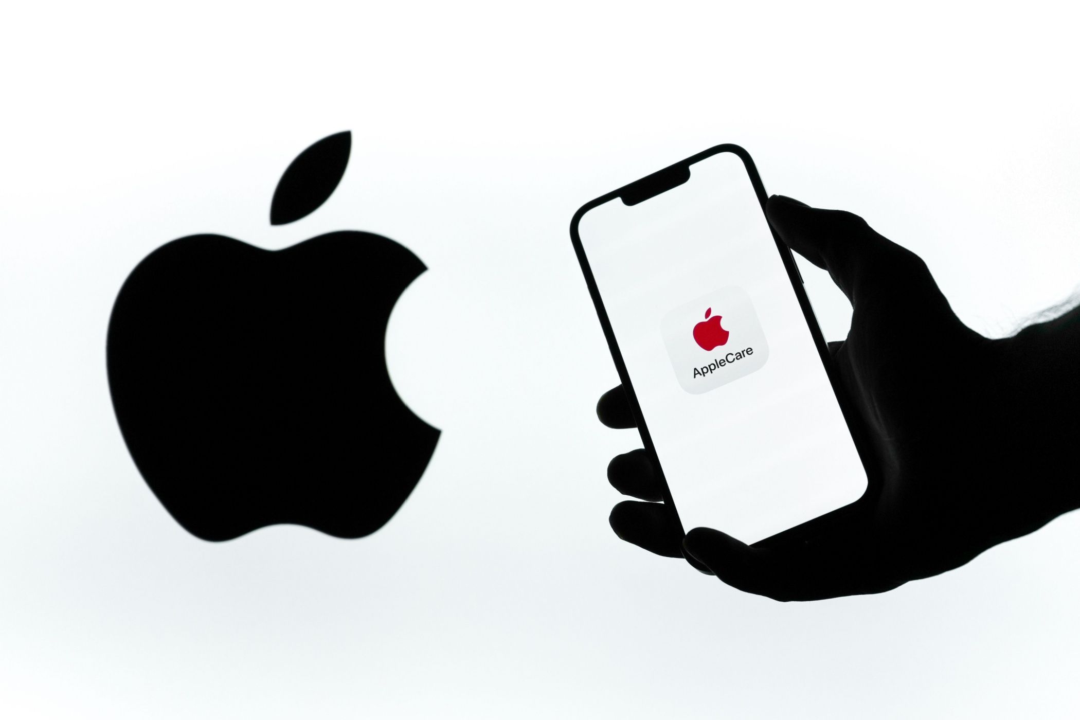 AppleCare Logo on phone, next to Apple logo