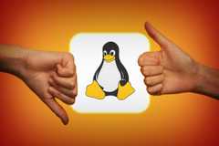 Hands showing thumbs up and thumbs down around the Linux logo, indicating mixed opinions on the operating system.