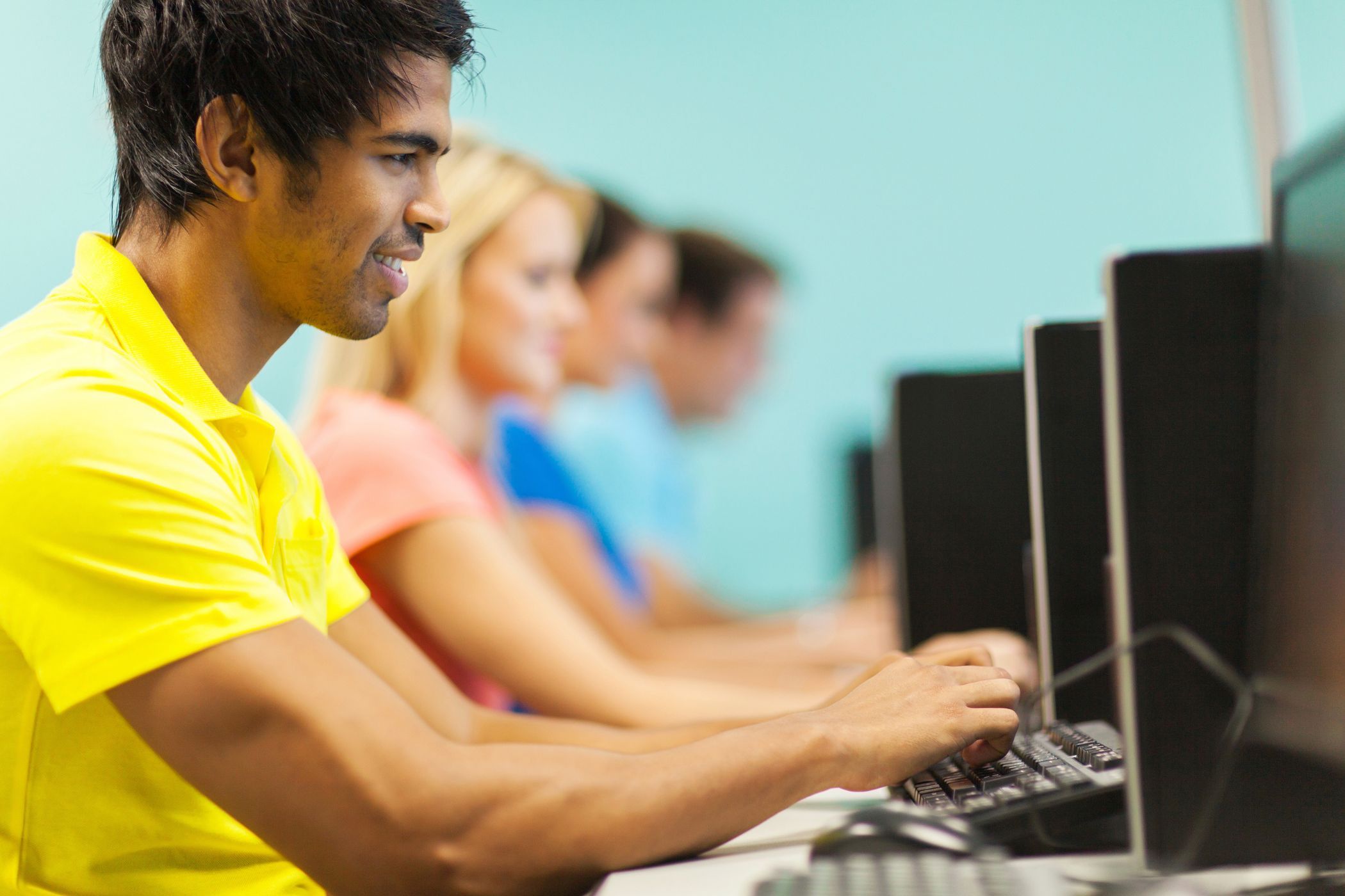 people using pcs in a computer lab