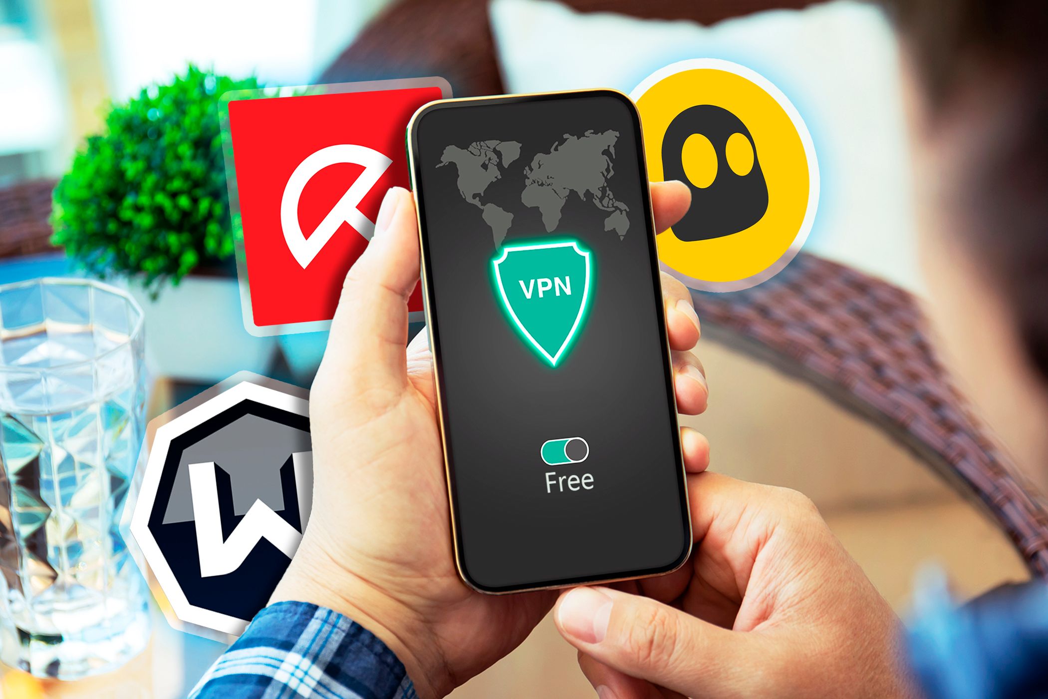 دستی که گوشی هوشمندی را با یک VPN و برخی نمادهای دیگر برنامه های VPN در اطراف آن در دست گرفته است. (1)