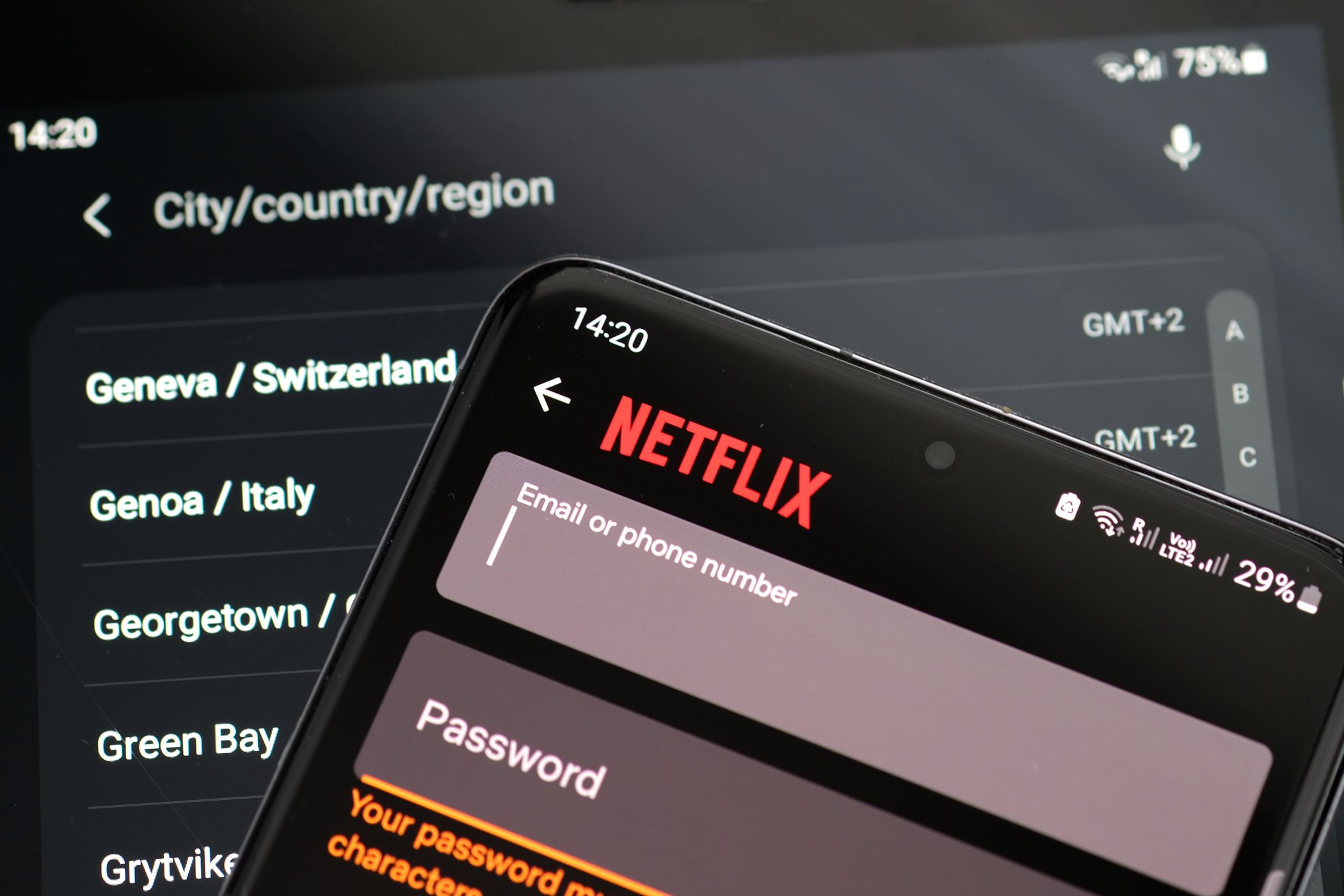 netflix sign in page with vpn server options in background