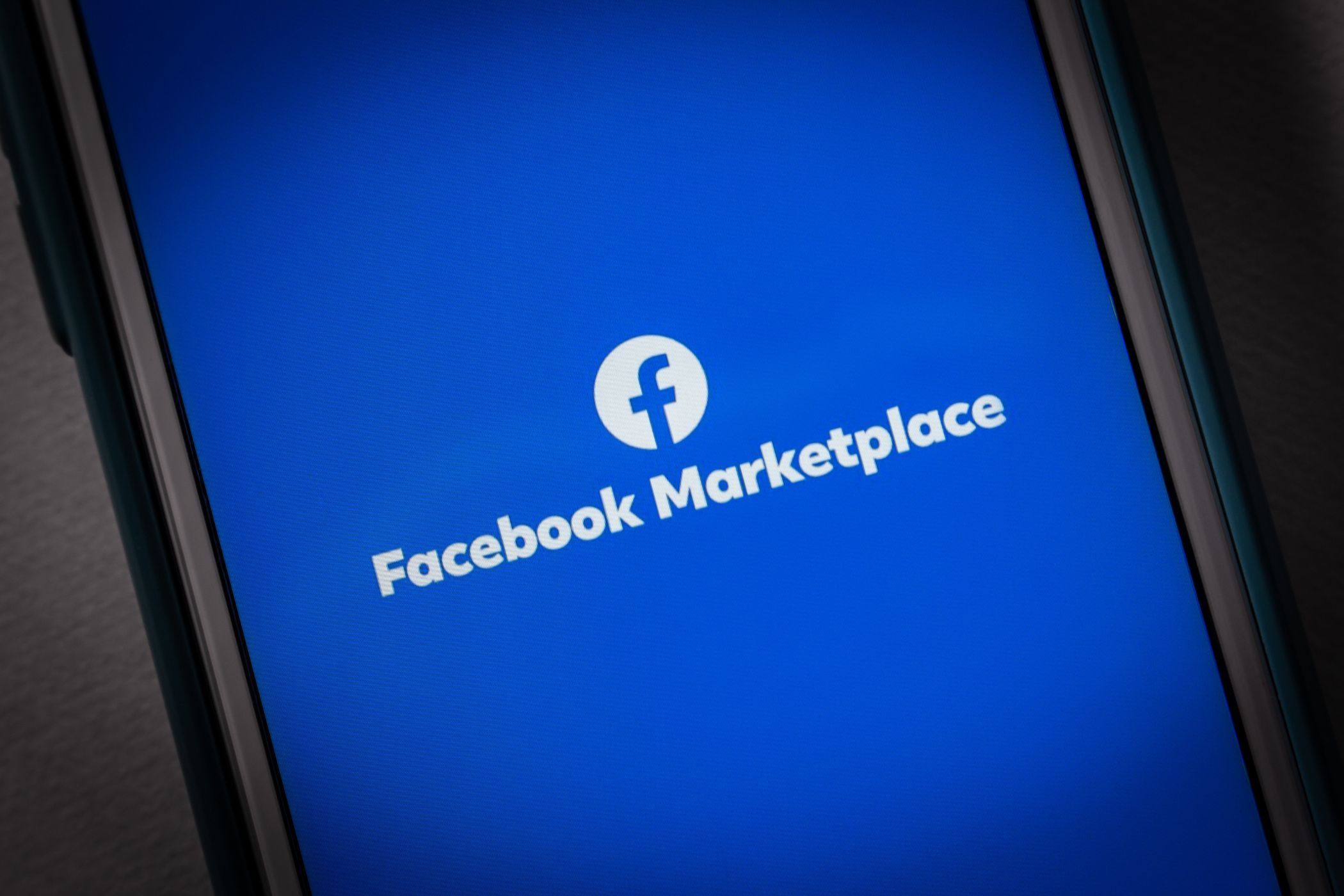 the facebook marketplace logo on a smartphone