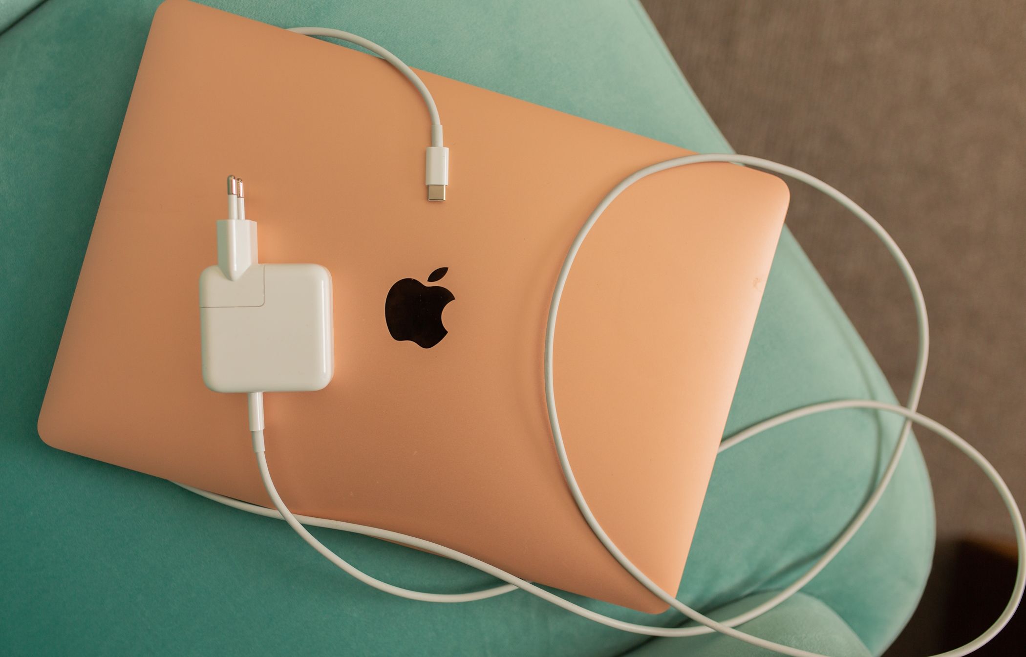 MacBook Air with its power adapter and USB-C cable