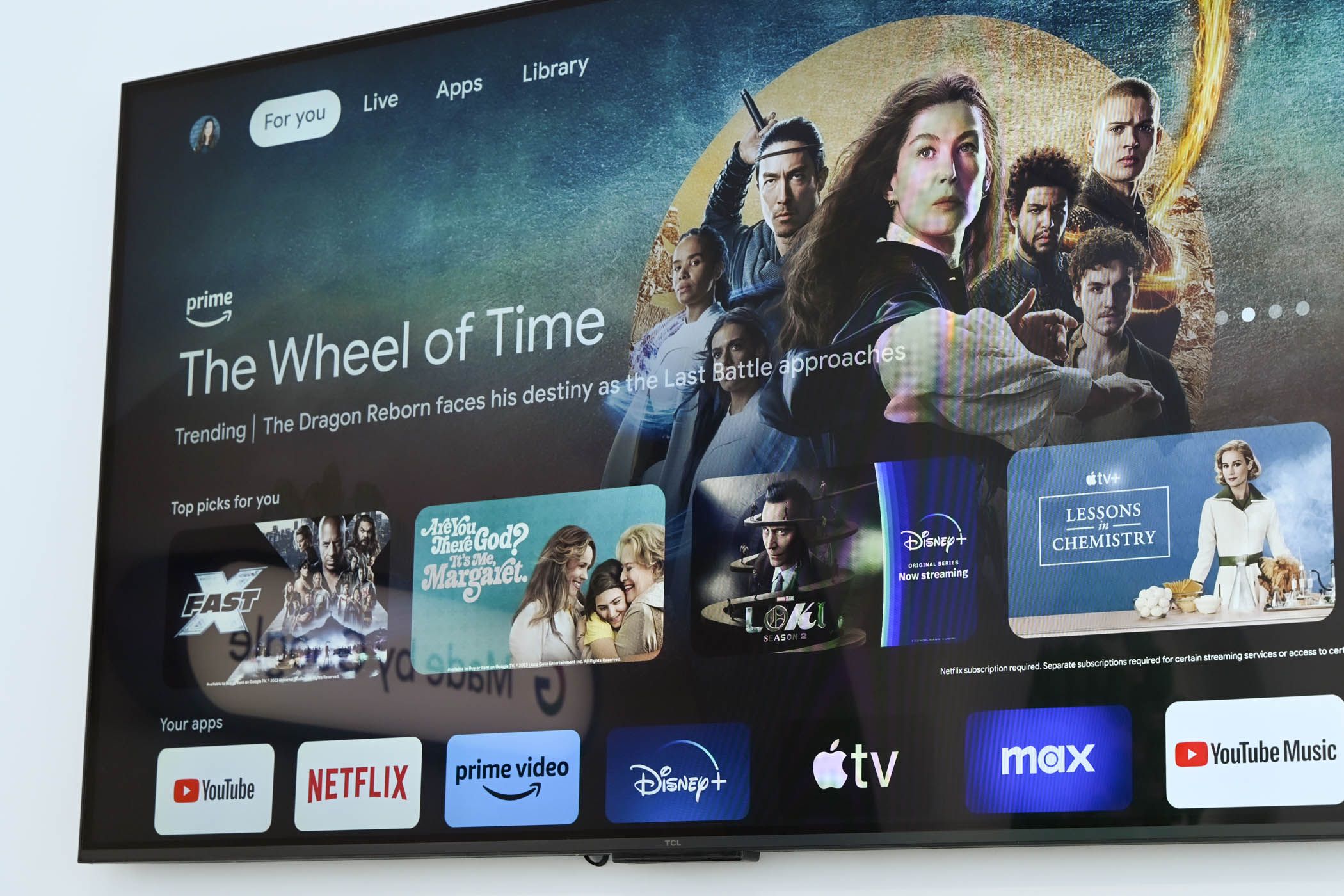 A smart TV on its homepage, showing apps for YouTube, Netflix, Prime Video and more