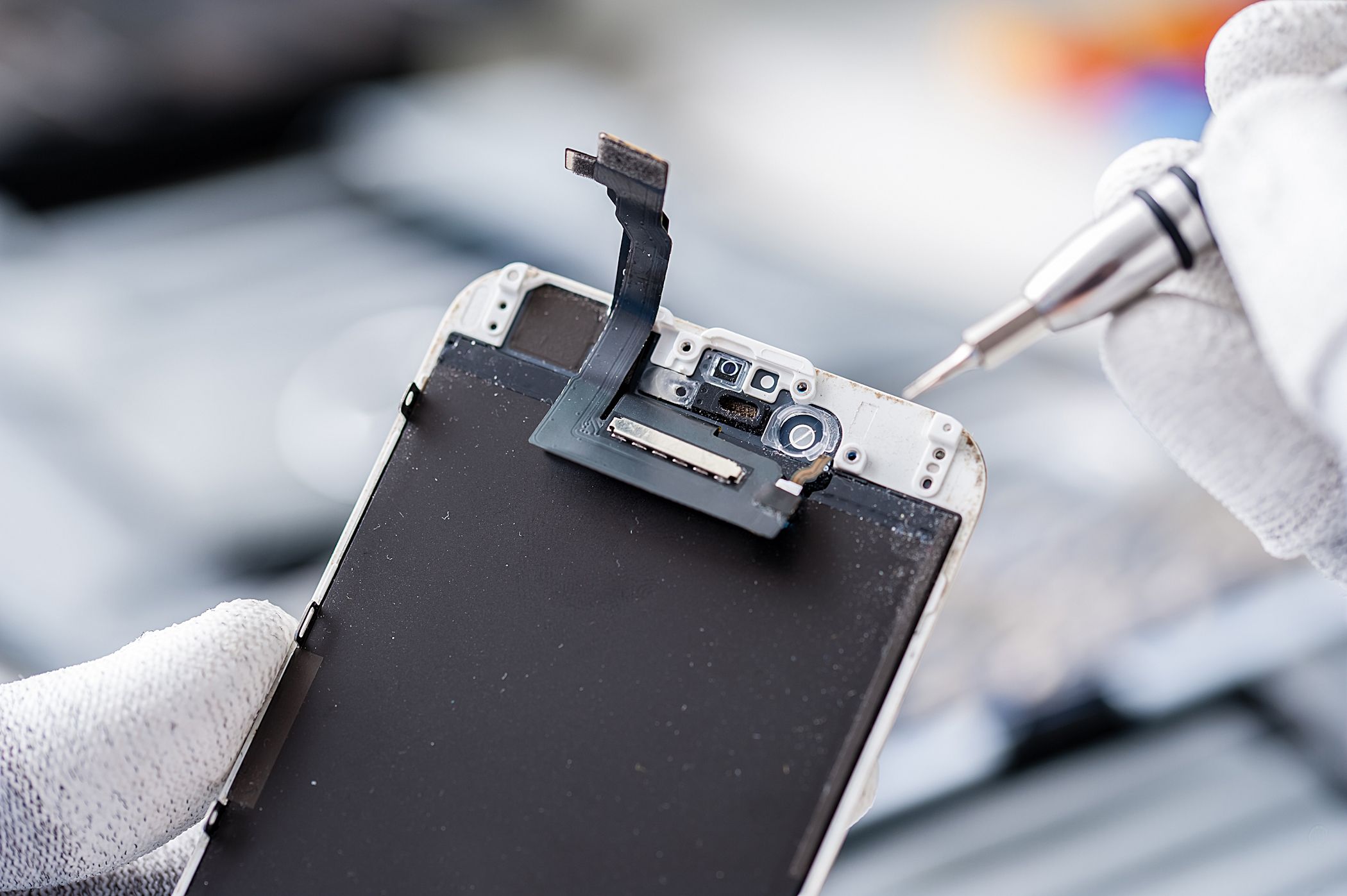 A close-up of a phone repair in progress