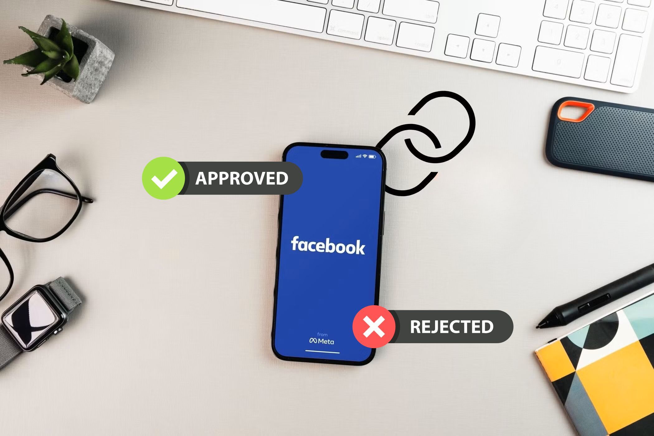 a smartphone on a desk with the facebook app with approved and rejected icons