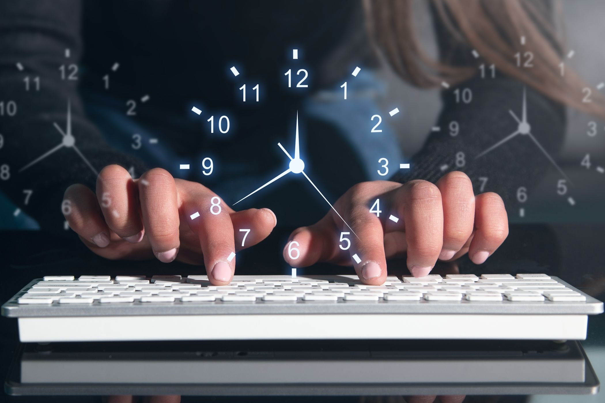 A woman typing on a keyboard with a clock illustrated over it