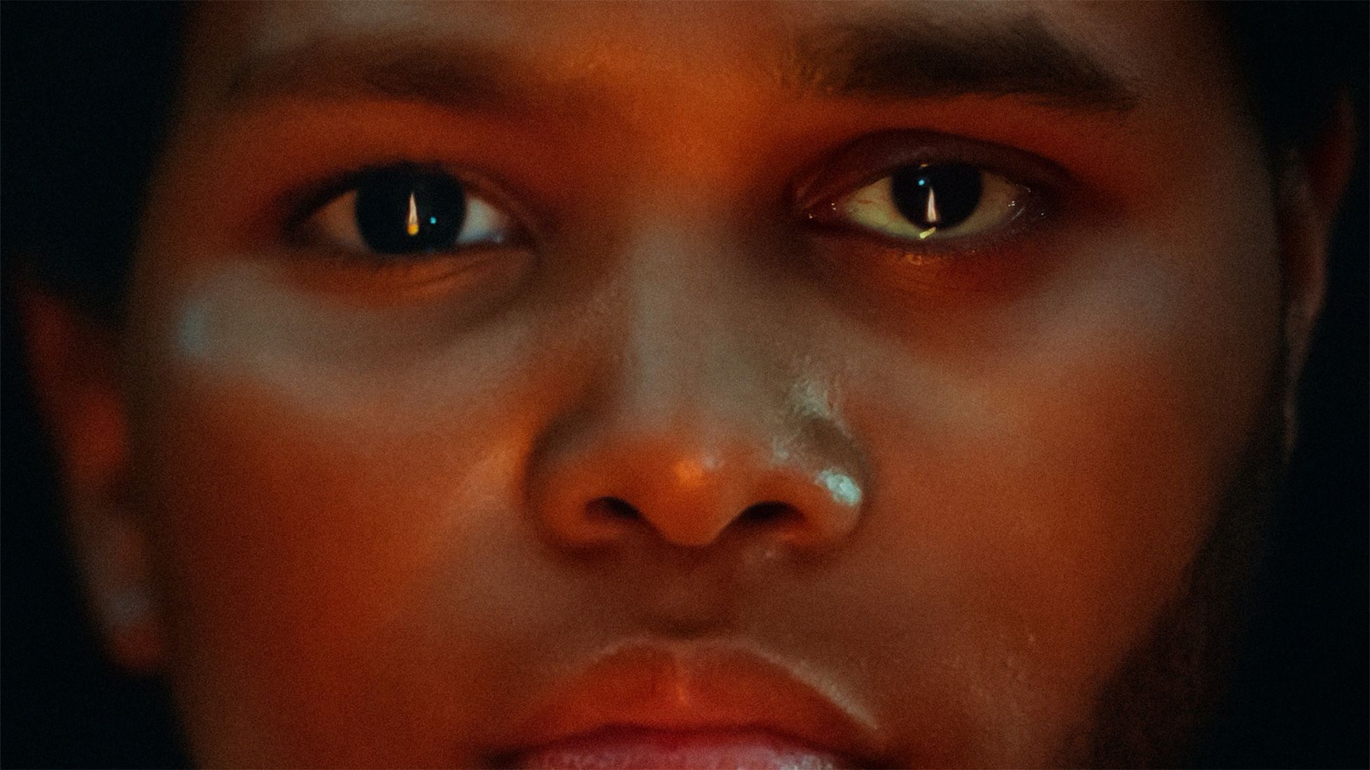 A close up image of a person's face, featured in The Weeknd's upcoming immersive music video for Apple Vision Pro