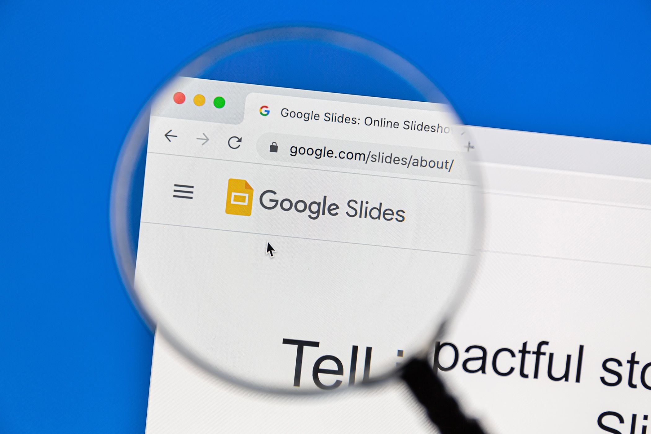 Google Slides logo under a magnifying glass