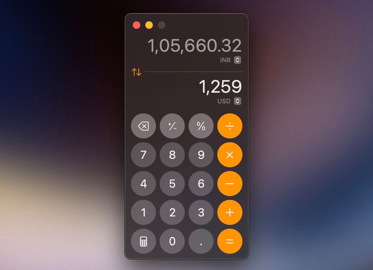 Performing currency conversion in the Calculator app on a Mac.