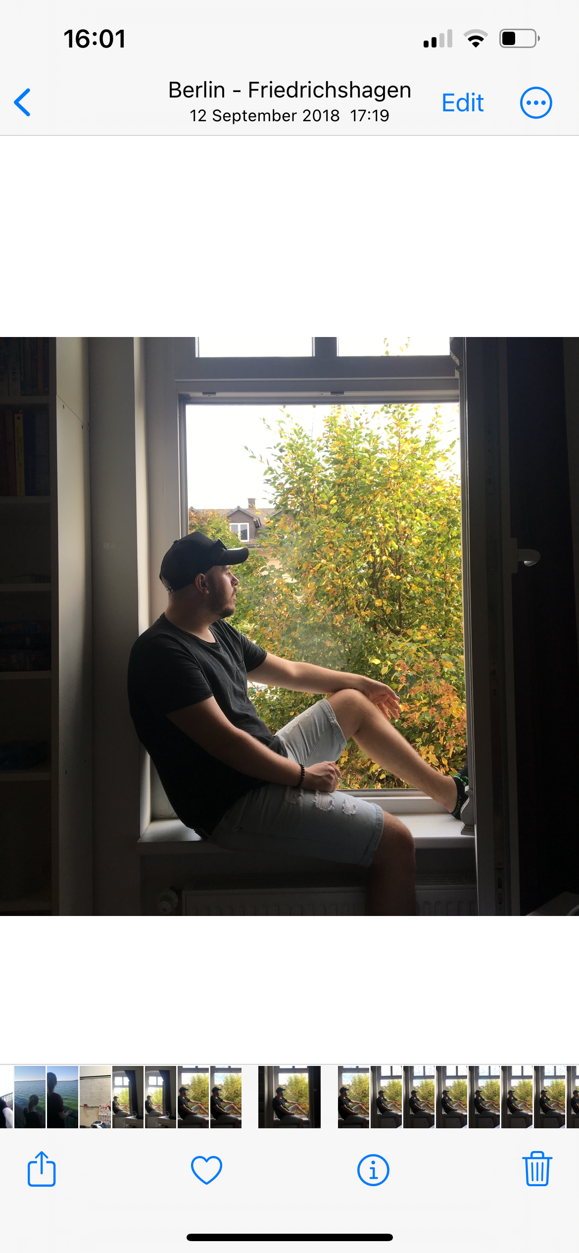 Man Sat in Window in iPhone Photos Library