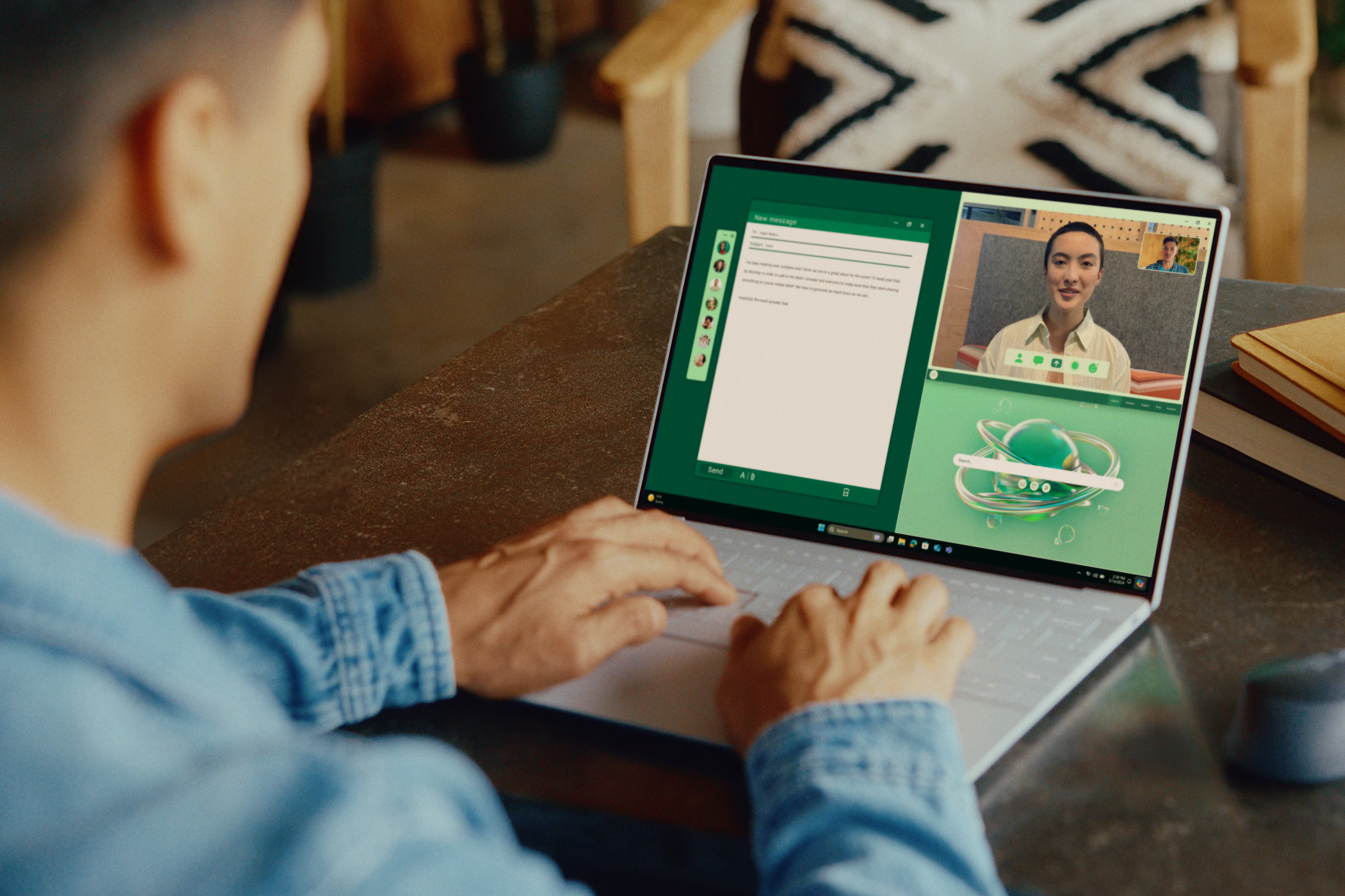 A man uses a Dell XPS 13 Snapdragon X Elite laptop.