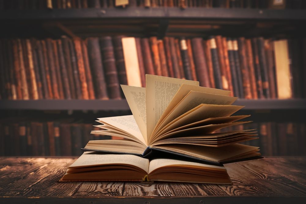 Open books on a wooden table