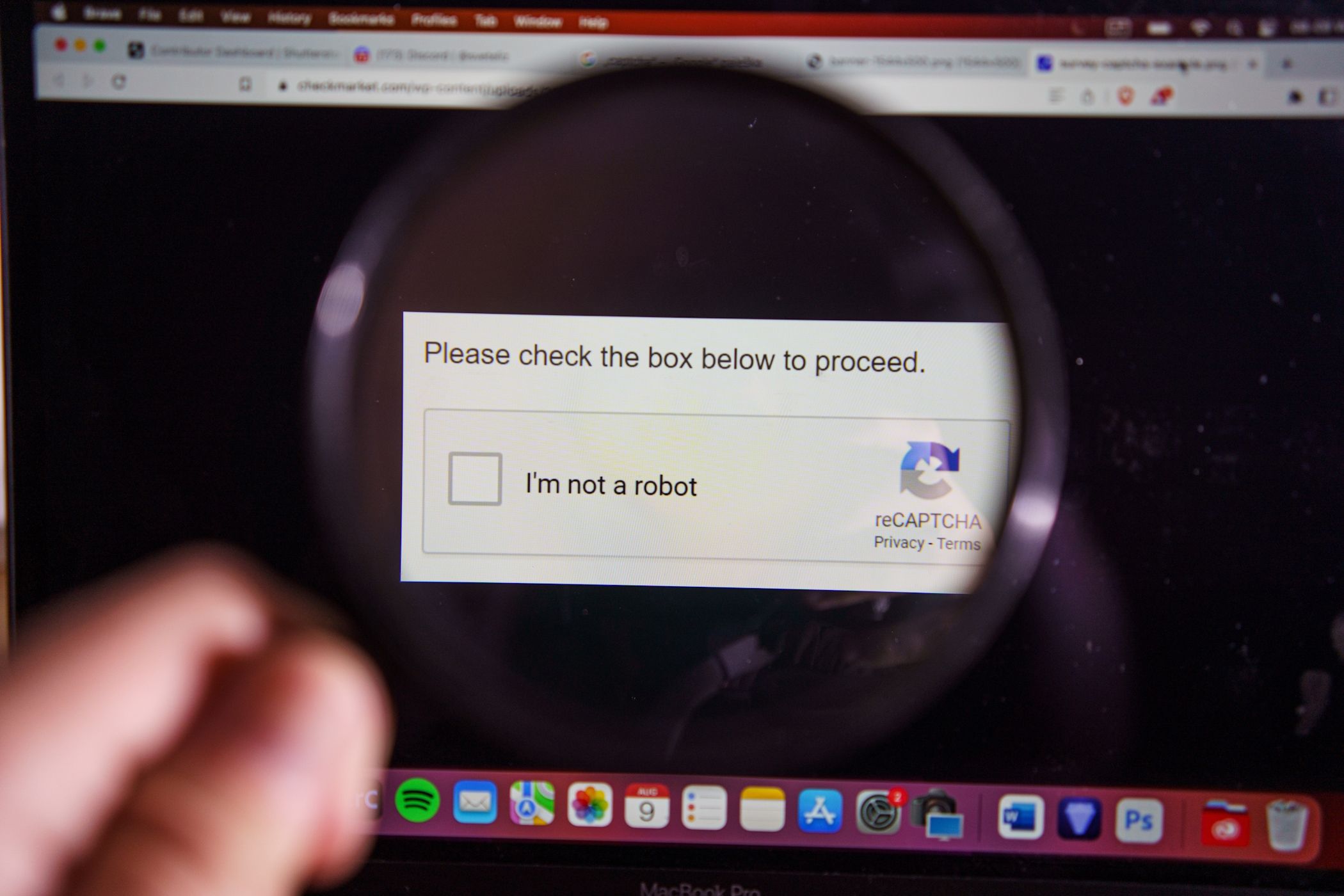 Viewing a Captcha on a MacBook through a magnifying glass