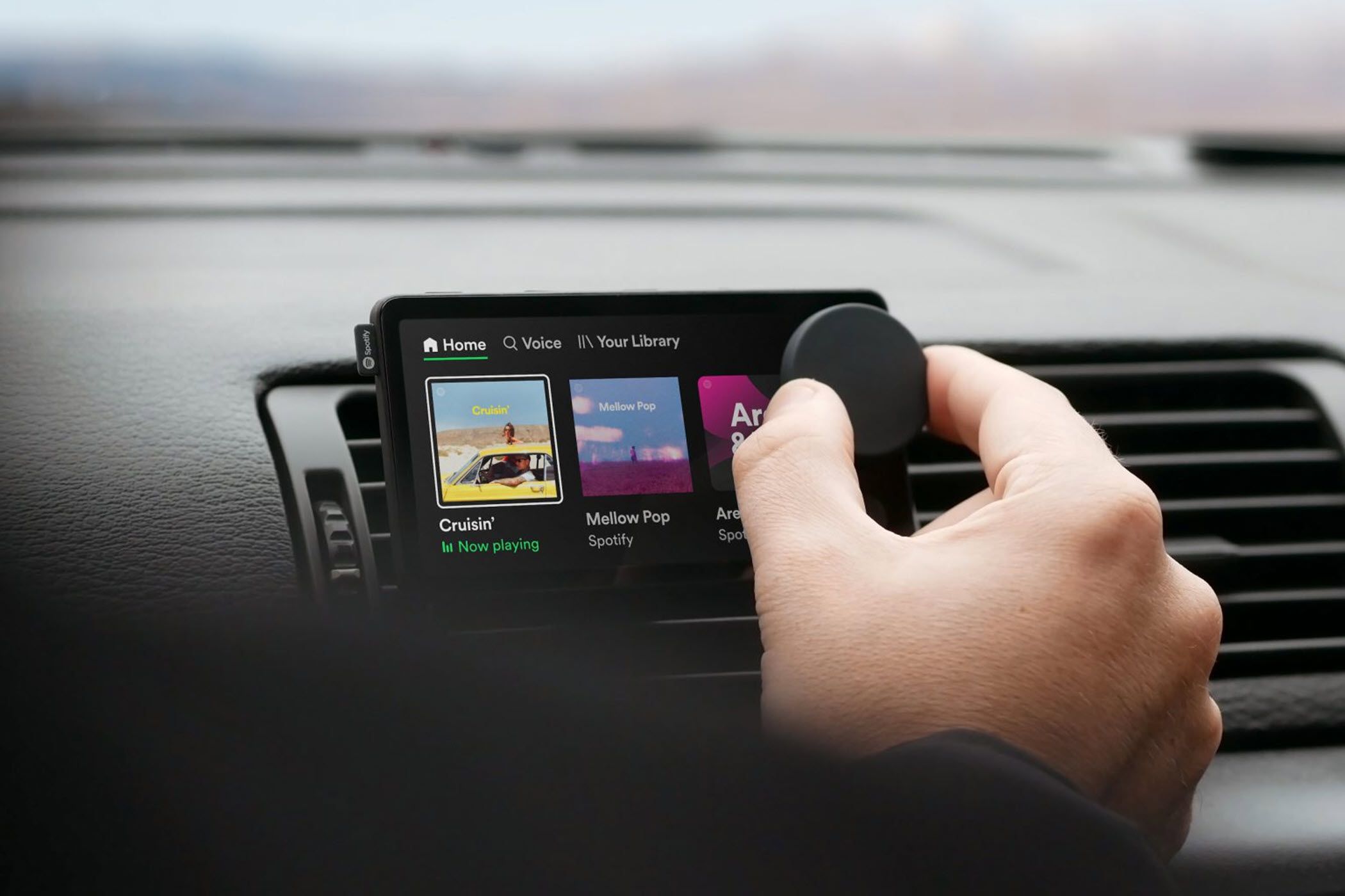 The Spotify Car Thing attached to a car's vent