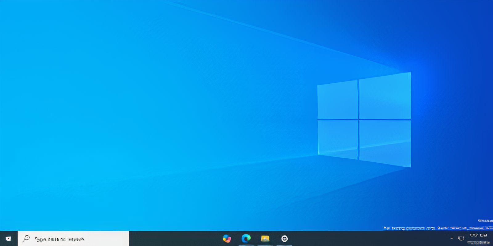 The Windows 10 desktop with centered app icons on the Taskbar using TaskbarX app