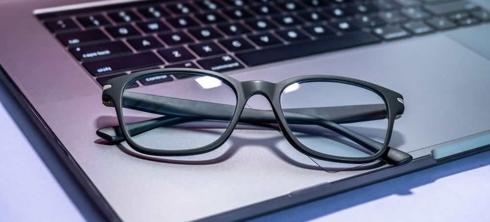 Blue light filter glasses on a laptop