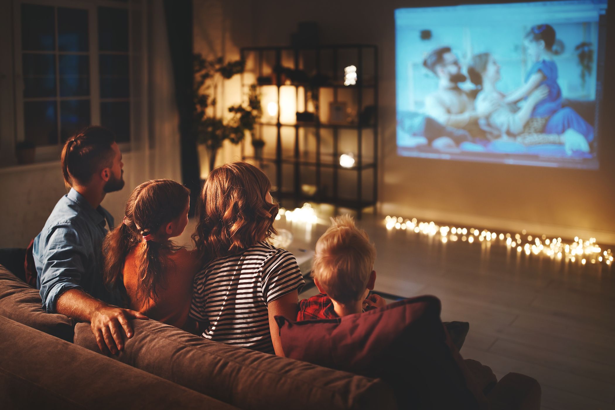 family watching film on projector