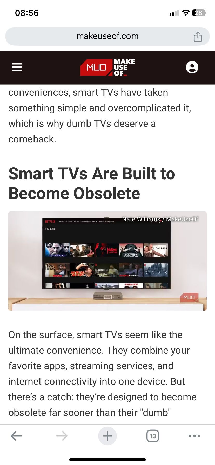 A MakeUseOf article displayed on the iPhone screen.