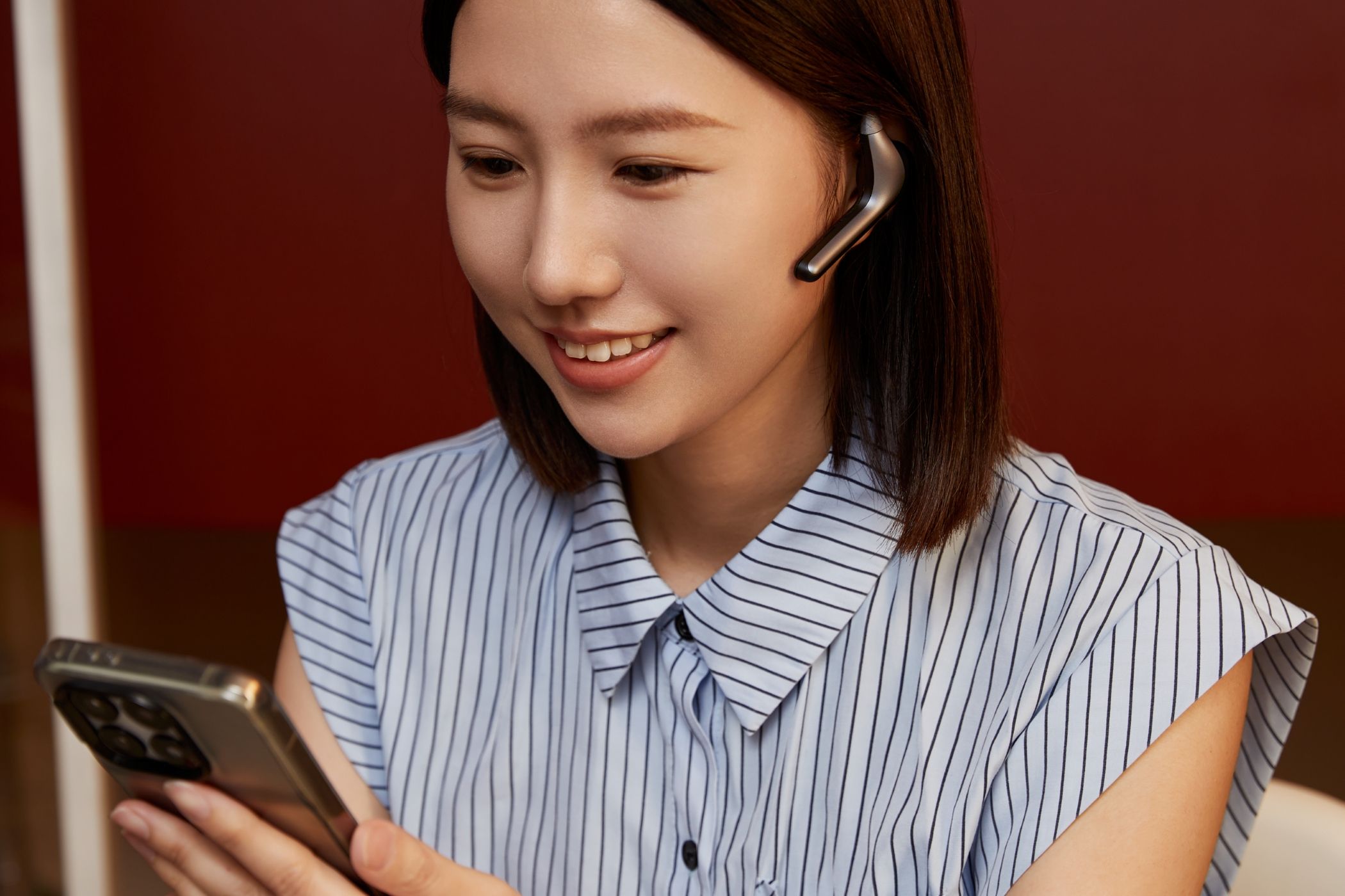 A Young Woman Making a Video Call Using the W4 Pro Earbuds 