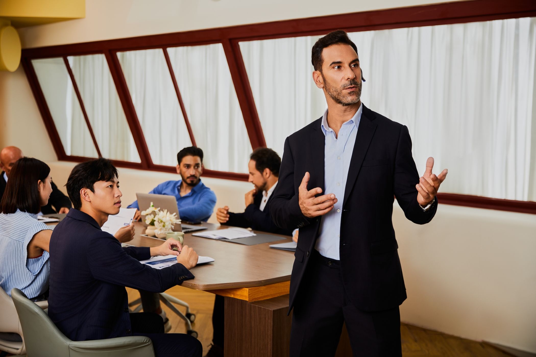 An Executive Giving a Presentation Using the Timekettle W4 Pro Earbuds