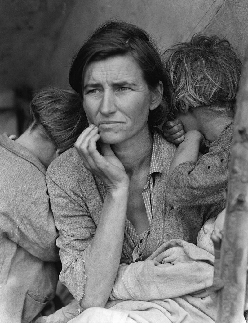 An iconic photograph taken by Dorothea Lange depicting a mother holding her children during the great depression.