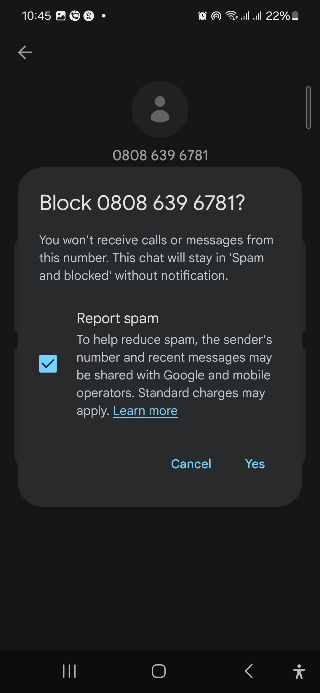 A pop-up message confirming whether a number should be blocked and reported as spam-1