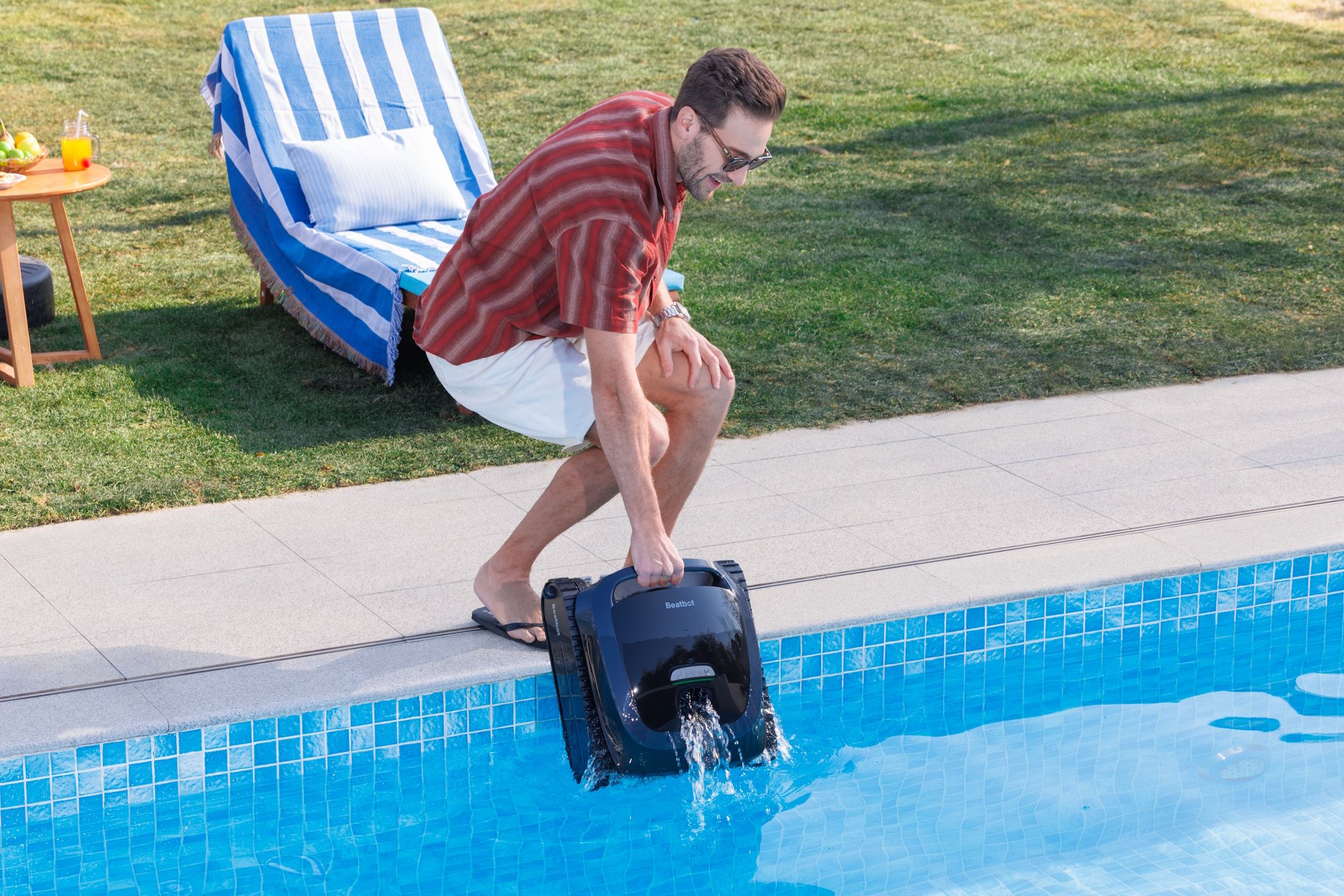 man lifting aquasense 2 out of swimming pool