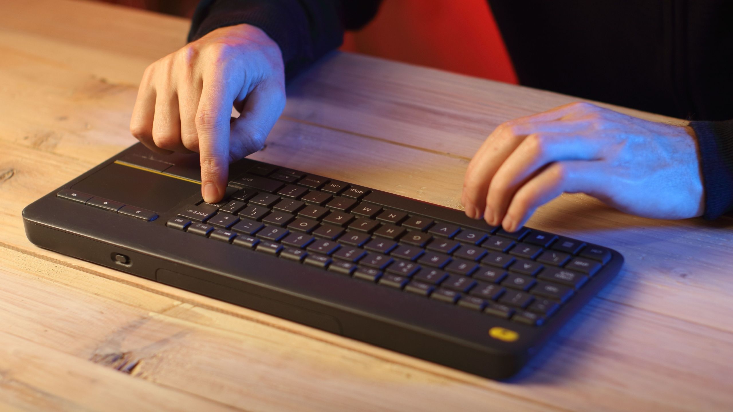 Hands Typing on Wireless Keyboard