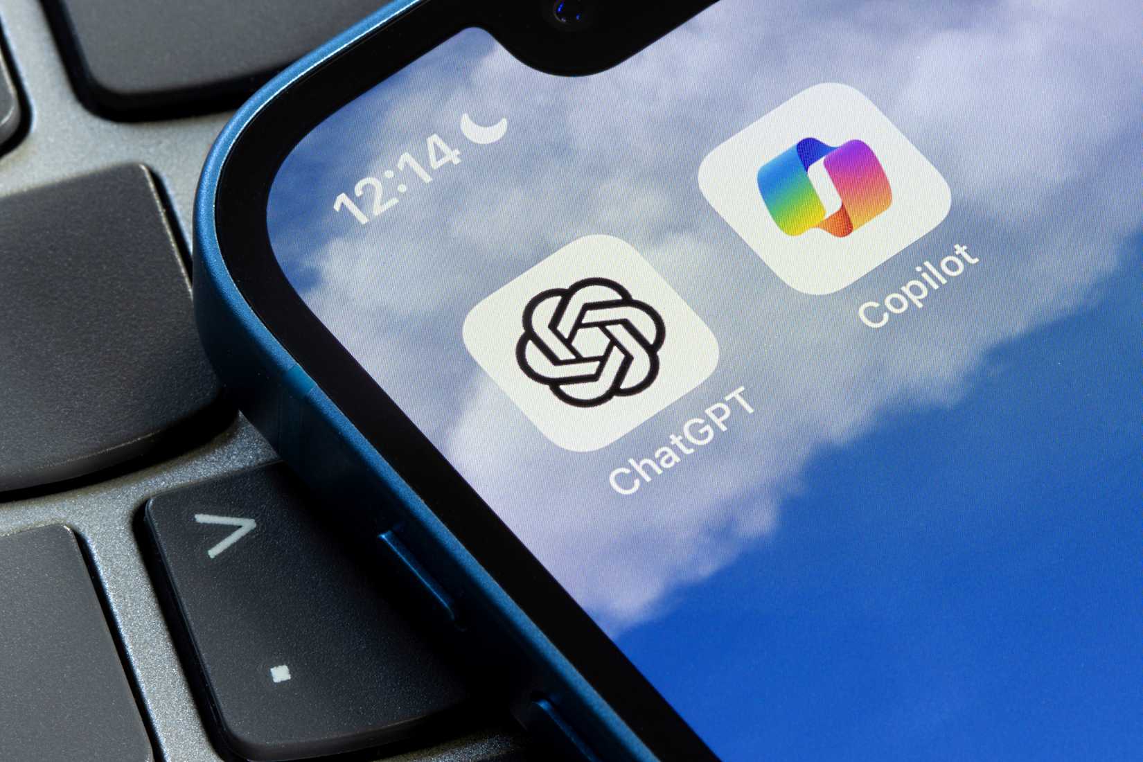 microsoft copilot and chatgpt logos on smartphone screen.