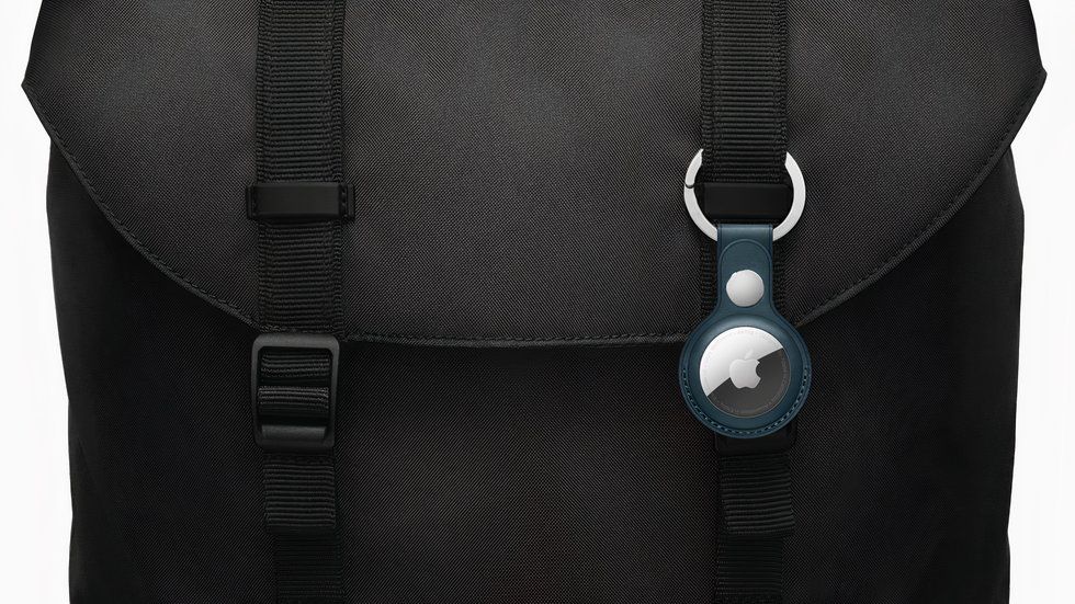 An Apple AirTag attached to a bag.