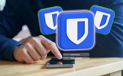 person inputting password with bitwarden logos.