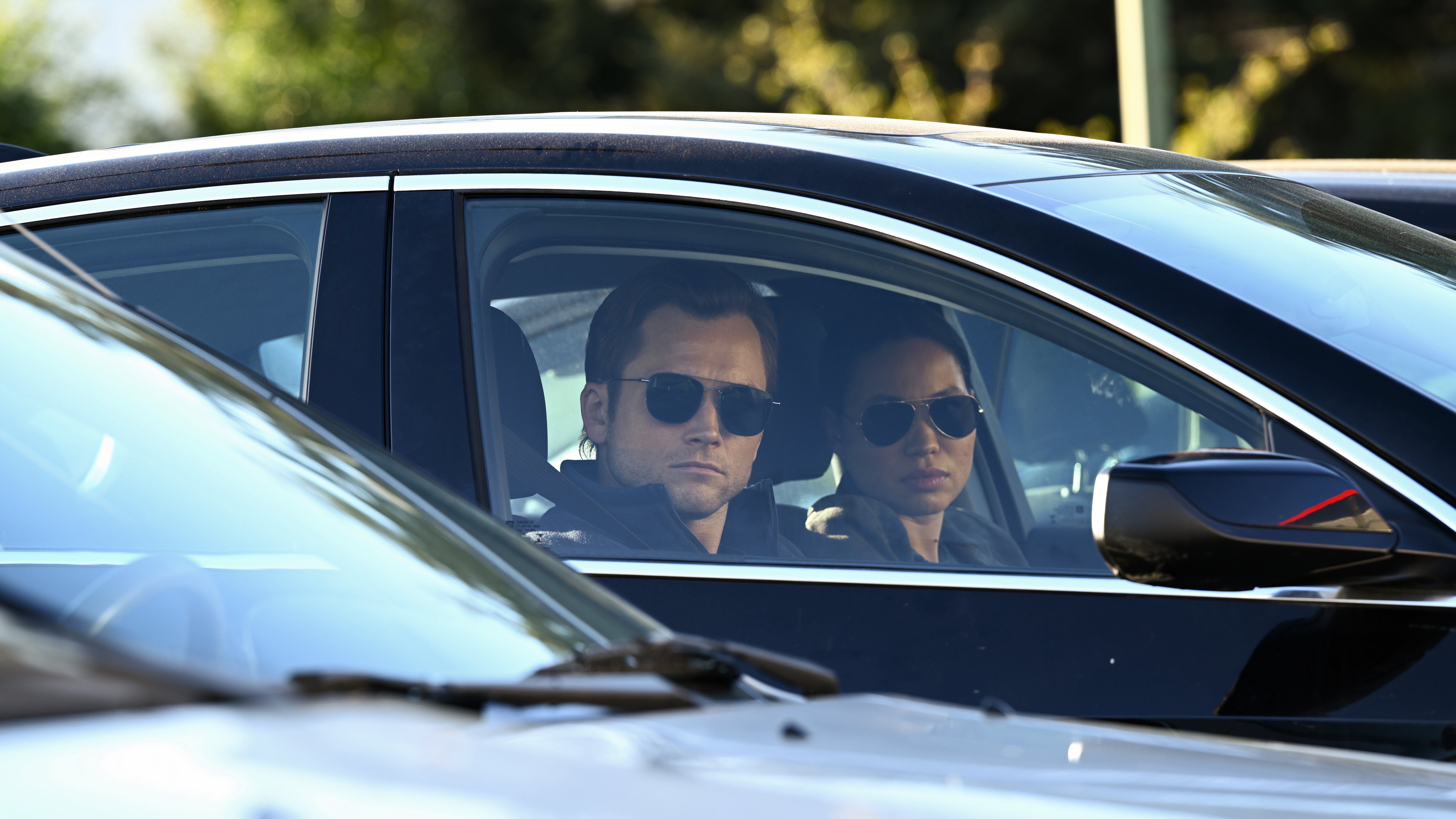 An images of an episode of Smoke showing Taron Egerton as Dave Gudsen and Jurnee Smollett as Detective Michelle Calderone